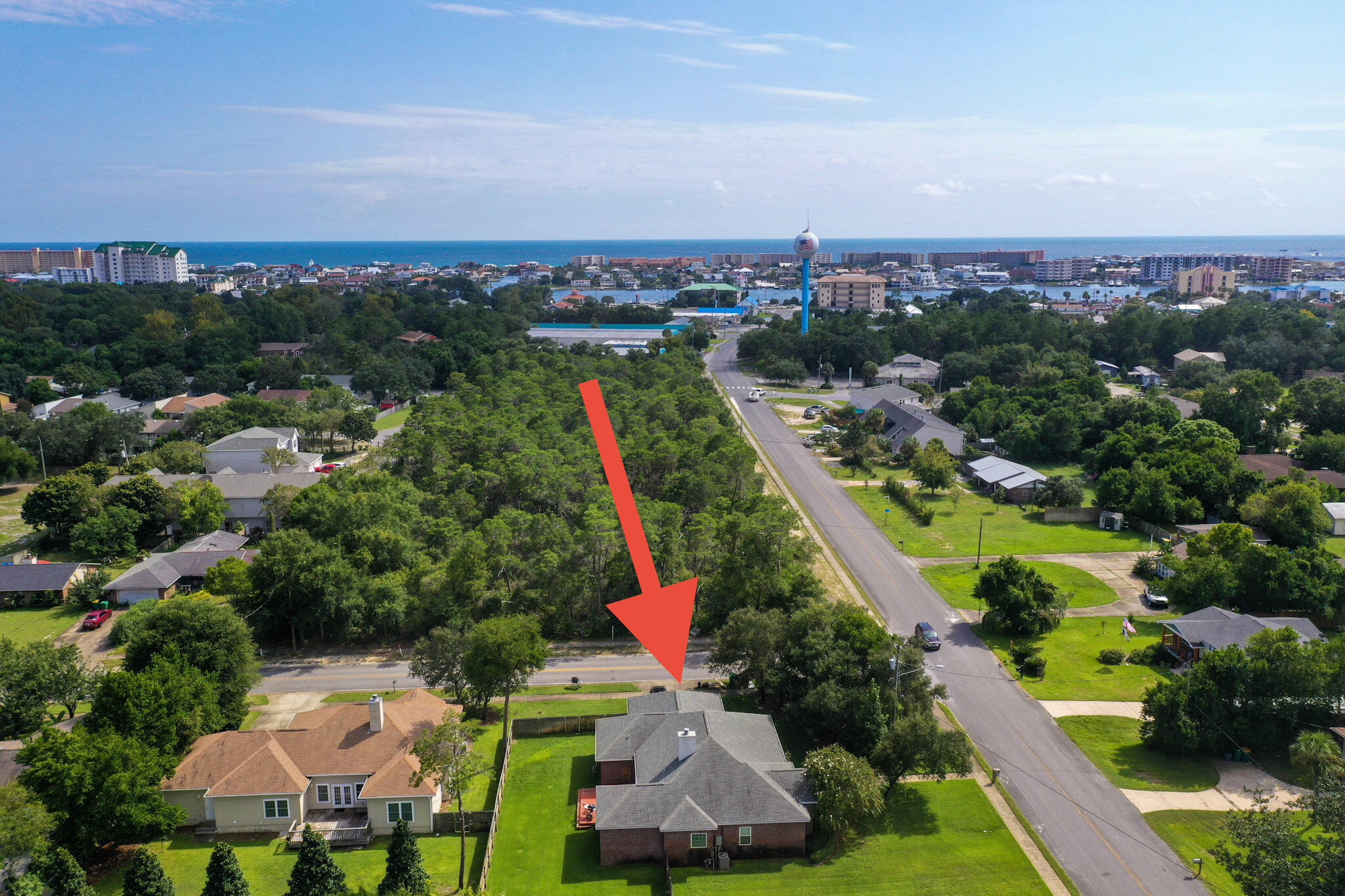 Located in the heart of Destin, this beautiful home is located on a great 1/4 acre corner lot and is convenient to restaurants and the Destin Harbor. Inside you will find beautiful hardwood flooring, tall ceilings, large bedrooms and a fabulous kitchen. Other notable features include a sizable fully fenced in backyard (plenty of room to add a pool), two car garage/workshop, security cameras, tankless hot water heater, sprinkler system and a large covered front porch. NO HOA! Come see this home today! Home is being sold AS-IS.