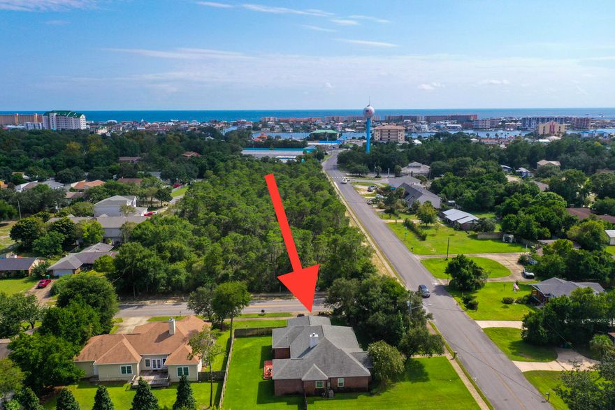 Located in the heart of Destin, this beautiful home is located on a great 1/4 acre corner lot and is convenient to restaurants and the Destin Harbor. Inside you will find beautiful hardwood flooring, tall ceilings, large bedrooms and a fabulous kitchen. Other notable features include a sizable fully fenced in backyard (plenty of room to add a pool), two car garage/workshop, security cameras, tankless hot water heater, sprinkler system and a large covered front porch. NO HOA! Come see this home today! Home is being sold AS-IS.