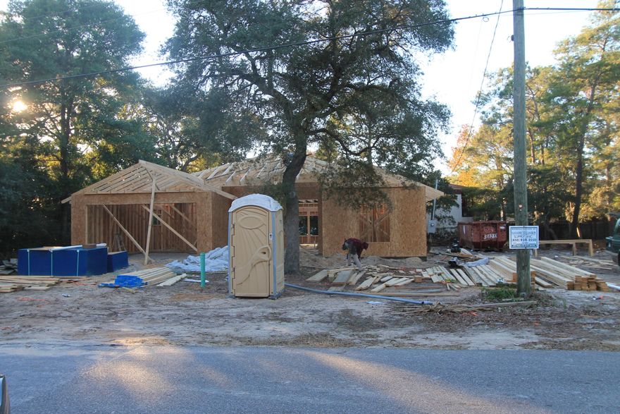 Awesome new floor plan by multiple award winning builder!! Contract now to customize!!! This 4/3 custom brick home has super curb appeal, and is being constructed on large lot There are 10 Ft. Ceilings w/ impressive crown molding, will have hand scrapped hardwood flooring, and 5 1/4'' baseboard throughout the main living areas. As you enter the home through the covered front porch, the formal dining room is on your right. As you continue down the hallway, you will then enter the chef's delight kitchen which will boast custom maple cabinetry, granite countertops, 2 large pantry's, and stainless appliances (including an oversized commercial grade frig./freezer). Please view photos for appliance info. This plan is a split bedroom, where bedrooms 1 - 3, and baths 1 and 2, are located at the right of the home. The master suite is in the rear of the home, is very roomy, has 2 large walk - in closets, a custom tiled walk - in shower with class enclosure, a whirlpool garden tub, a double vanity and a linen closet. The laundry room is conveniently located at the rear of the kitchen. The oversized greatroom is located at the rear of the kitchen, and opens to a covered porch, which is perfect for entertaining.  The yard will be beautifully landscaped, have a privacy fence, and comes complete w/ a well, sprinkler system and timer. Insurance will be very reasonable, as home is built to today's code. Home has a Taexx ''in the wall'' pest control system, that is serviced from the exterior of the home, for owner's convenience. Completion is expected in late March. 