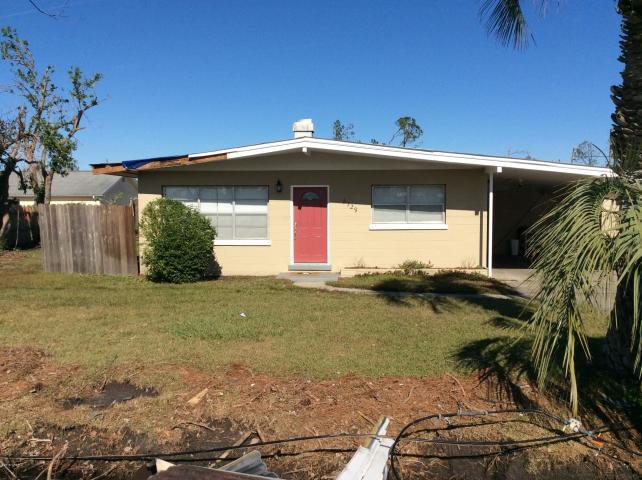 HUGE INCOME POTENTIALl! Great Price and Location. Don't miss this opportunity! 3 Bdrm, 2 Bath corner lot home was remodeled in 2016 and has damage to a portion of the roof and ceiling in kitchen and dining room. Many upgrades throughout the home. New flooring will be needed in bedrooms. Outside storage room wall has minor visual damage. New HVAC unit installed in 2018. Electrical service entrance panel will need repair. Within walking distance to the zoned schools. Minutes from Tyndall AFB. This fixer upper will not last long. Owner selling As Is and will not be making any repairs.