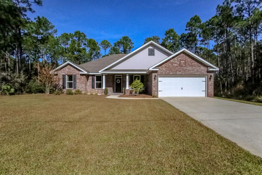 Wonderfully built 4/3 Home with Brick and Board & Baton Exterior. Granite counter-tops and shaker cabinets through-out the house. Spacious bedrooms and bathrooms. The large master suite includes a tray ceiling, walk-in closet, walk-in-shower and separate soaking tub. Just shy of half an acre. Conveniently located near shopping, schools, and Navarre Beach with easy access to Hwy 87 and Hwy 98.
