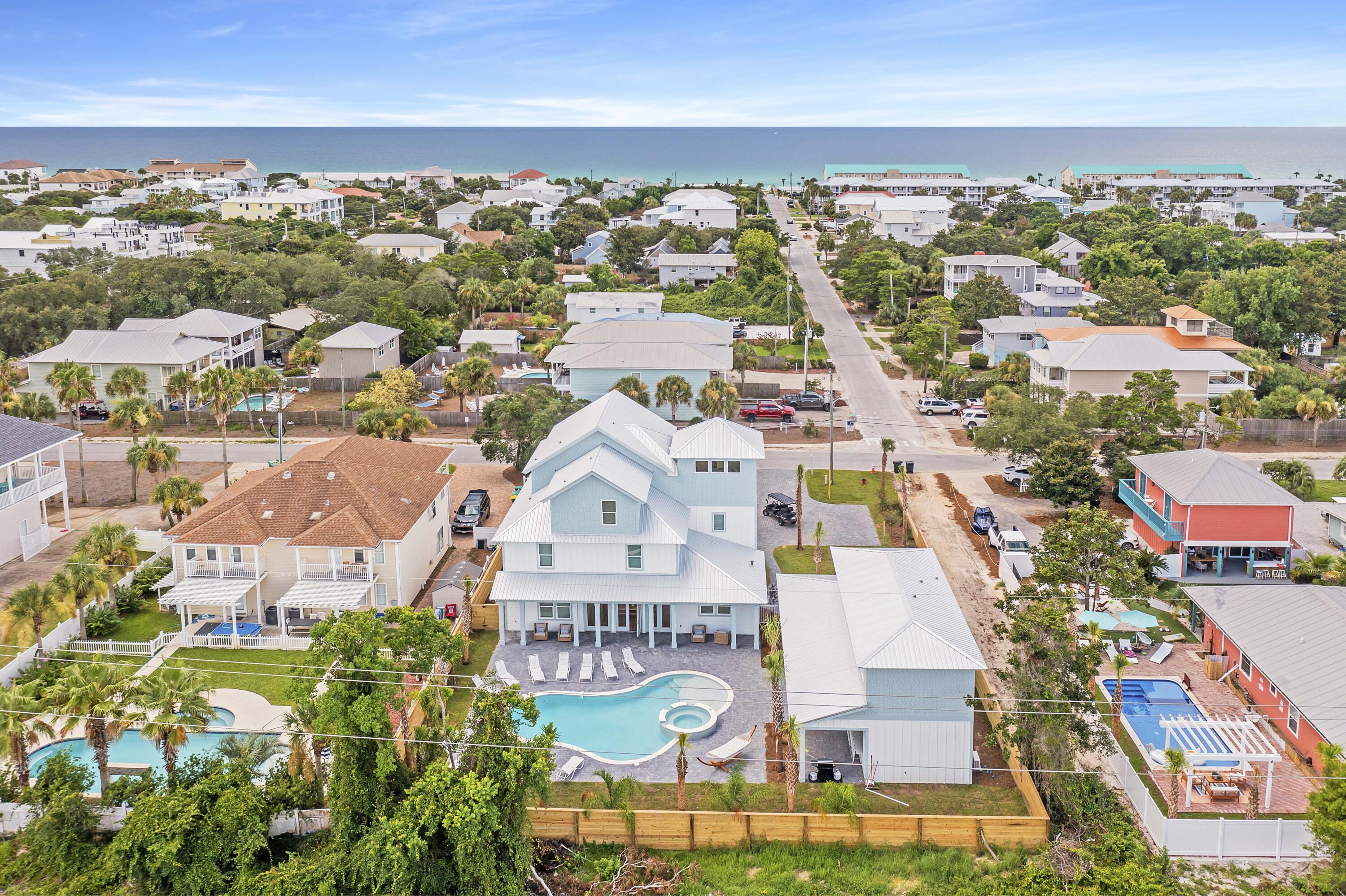 4575 Luke Avenue is an investor's dream! Located in Crystal Beach, the heart of Destin. This stunning property offers luxurious living and lucrative investment potential. Rental actuals for 2023 were $325k and 2024 YTD is at $303k. This expansive home boasts 11 bedrooms, 11.5 bathrooms, and a generous 6373 square feet of living space, ideal for hosting and relaxation. Nestled on a rare double lot, this home features a pool and private outdoor space, creating a serene oasis. The addition of a carriage house provides ample space and flexibility for large groups. Enjoy modern comforts with multiple living rooms, kitchenettes, and a game room. Enjoy the beautiful Emerald Coast beaches in less than a 4-minute walk!