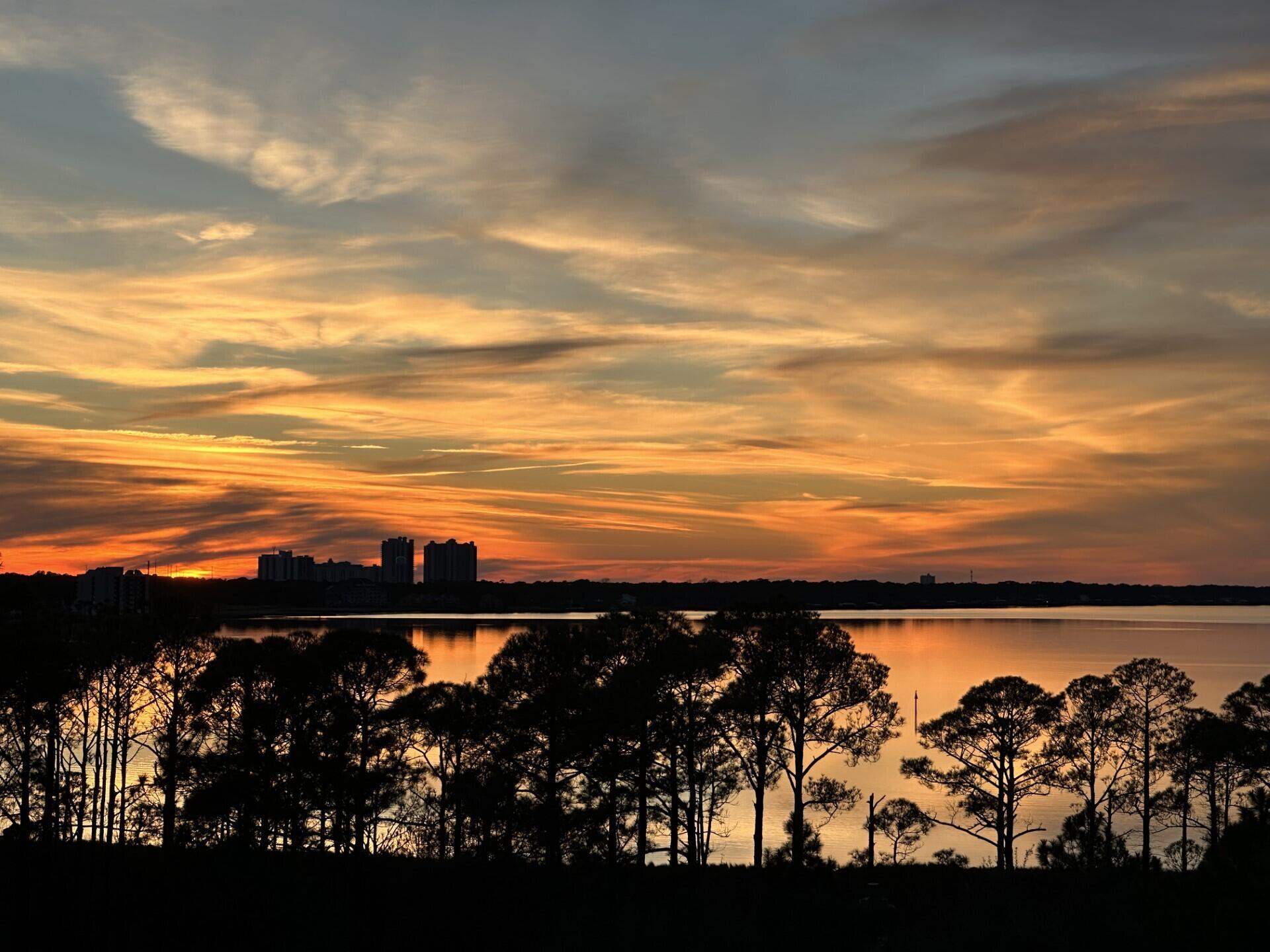 Back on Market due to no fault of Seller. Rental Machine! Gorgeous Bay and Sunset views from this beautiful studio in Sandestin's The Grand Sandestin Resort and Conference Center located within The Village of Baytowne Wharf at Sandestin. From 06-15-22 to 06-15-23 gross rental revenue was over $41,000. This studio sleeps four as it has a sleeper sofa and a comfortable bed. The amazing amenities are steps away including pool, hot tub, work out center. The crystal-clear waters of the Gulf of Mexico are a short shuttle ride away. This studio was tastefully updated a little over two years ago with furniture, flooring and appliances. Sandestin Golf and Beach resort encompasses over 2,400 acres with four golf courses, world class tennis and pickle ball center, walking/biking paths, and the world-famous beach. The Village of Baytowne Wharf has everything you need from a general market/convenience store to shops, restaurants and exciting night life. You will never have to leave the property, no need for a rental car. Rental projection is in document section. Short drive to Destin for all you Swifties! All information is considered accurate but should be verified by buyer.