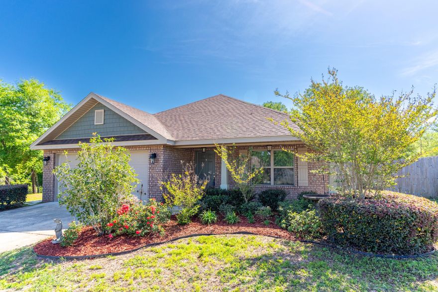 Magnolia Lake Subdivision, private lake, boating, picnic area and dock.  This well-maintained brick home built on a .29-acre corner lot  surrounded by woods for privacy.  3 bedrooms with split floor plan, 2 baths, freshly painted and new laminate vinyl plank floors with carpeted bedrooms.  Open floor plan, vaulted ceiling in kitchen, living room and dining room.  The master bedroom has tray ceiling, master bath with separate water closet, walk in shower, walk in closet, linen closet and double sinks.  Granite in bathrooms and kitchen.  Multiple closets and kitchen pantry give this home plenty of storage.  Double garage has lots of shelving and utility sink.  Within walking distance to schools, park with splash pad, 2 playgrounds, several sports areas.  Request showing today!