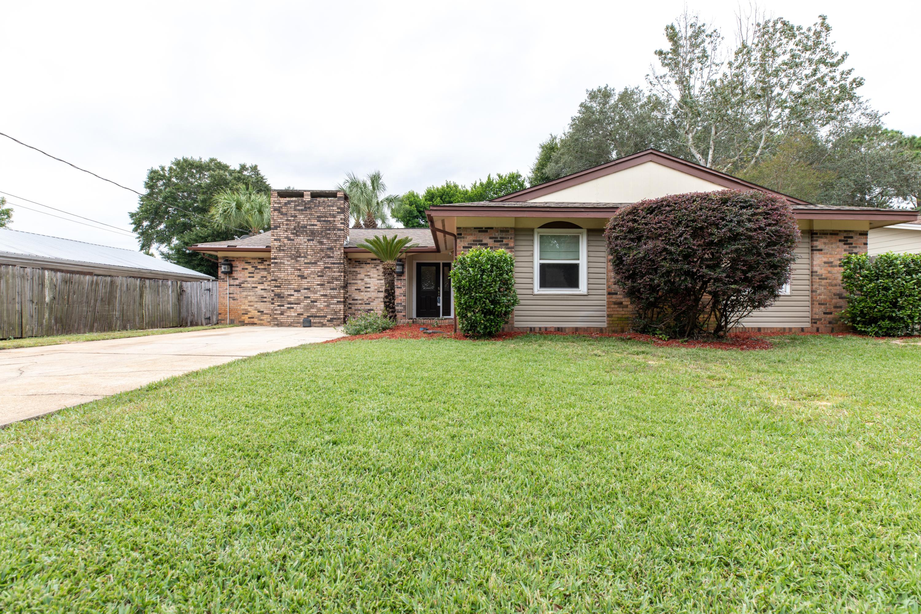 Location! Location! Location! This beauty is only an 8-minute drive to the beach, within walking distance to Cinco Bayou, Ferry Park Sports Complex and shopping at Uptown Station. This 4-bdrm 2.5 bath brick home with a tropical setting feels like you're at the beach. Enjoy the view from the Florida room or take the spiral staircase to the bonus room and hang out on the balcony overlooking the large pool. This is the best value in the neighborhood with lots of up-grades. Completely remodeled kitchen, new HVAC in 2014, new tile/luxury laminate/wood flooring, impact resistance windows, removable hurricane shutters and a well water sprinkler system. Pool, pool equipment and pool equipment storage building to convey ''AS IS''. Seller will provide American Home Shield 1 yr warranty up to $450