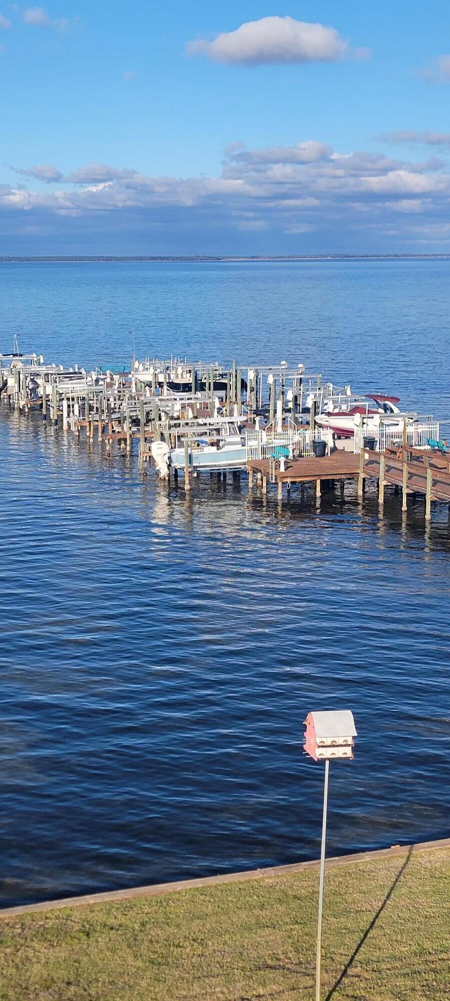 This beautiful 2-bedroom, 2-bath condo offers the perfect blend of relaxation and serene bay views. The open floor plan enhances the condo's airy feel, relax on your private balcony while taking in stunning views of Choctawhatchee Bay--perfect for unwinding after a day at the beach. This Boater's Paradise includes a dedicated boat slip with a lift, making it easy to have a relaxing day out on the water. Take advantage of the community clubhouse and a large, sparkling pool, ideal for social gatherings or a refreshing swim. This prime location allows you to enjoy the convenience of nearby shopping and dining options, with Harborwalk Village just 3.1 miles away and the renowned McGuire's Irish Pub a short 3.5 miles from your door.
Whether you're seeking a full-time residence or a vacation getaway, this non short term rental condo offers a perfect blend of luxury, convenience, and natural beauty. Don't miss your chance to experience coastal living at its finest schedule a viewing today!