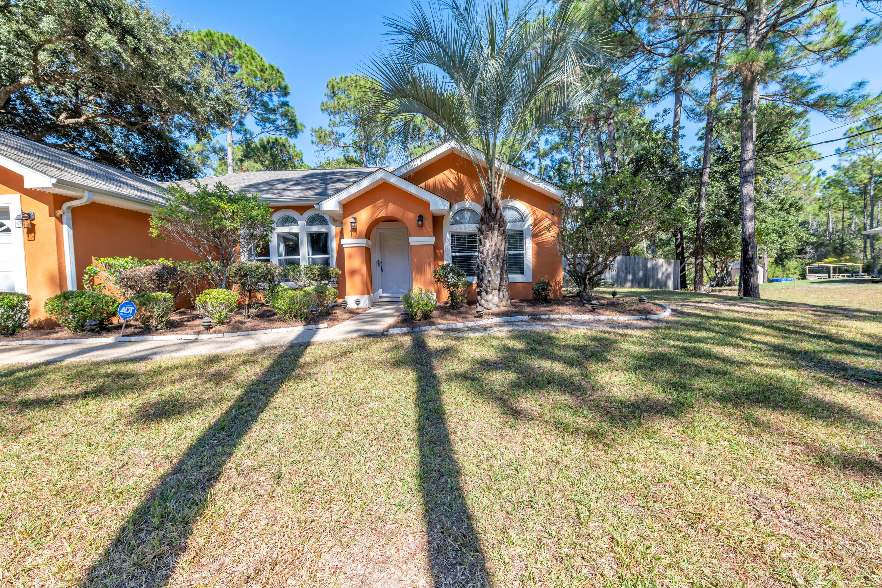 This charming  3BR, 2BA, 1,474 sq. ft. home with a 2-car garage brings style and a pop of color! Located in Holley by the Sea, it's one of only three homes on a quiet cul-de-sac. The 2022 HVAC, 2021 roof and water heater add to its appeal. Inside, you will love the natural lighting and open floor plan of the living room, dining area, and kitchen. With LVP flooring throughout plus tile in the kitchen and plank tile in both bathrooms, the home is move-in ready. Relax on the screened, covered back porch overlooking a large, fully fenced backyard--perfect for any lifestyle!Washer and Dryer will convey with property!