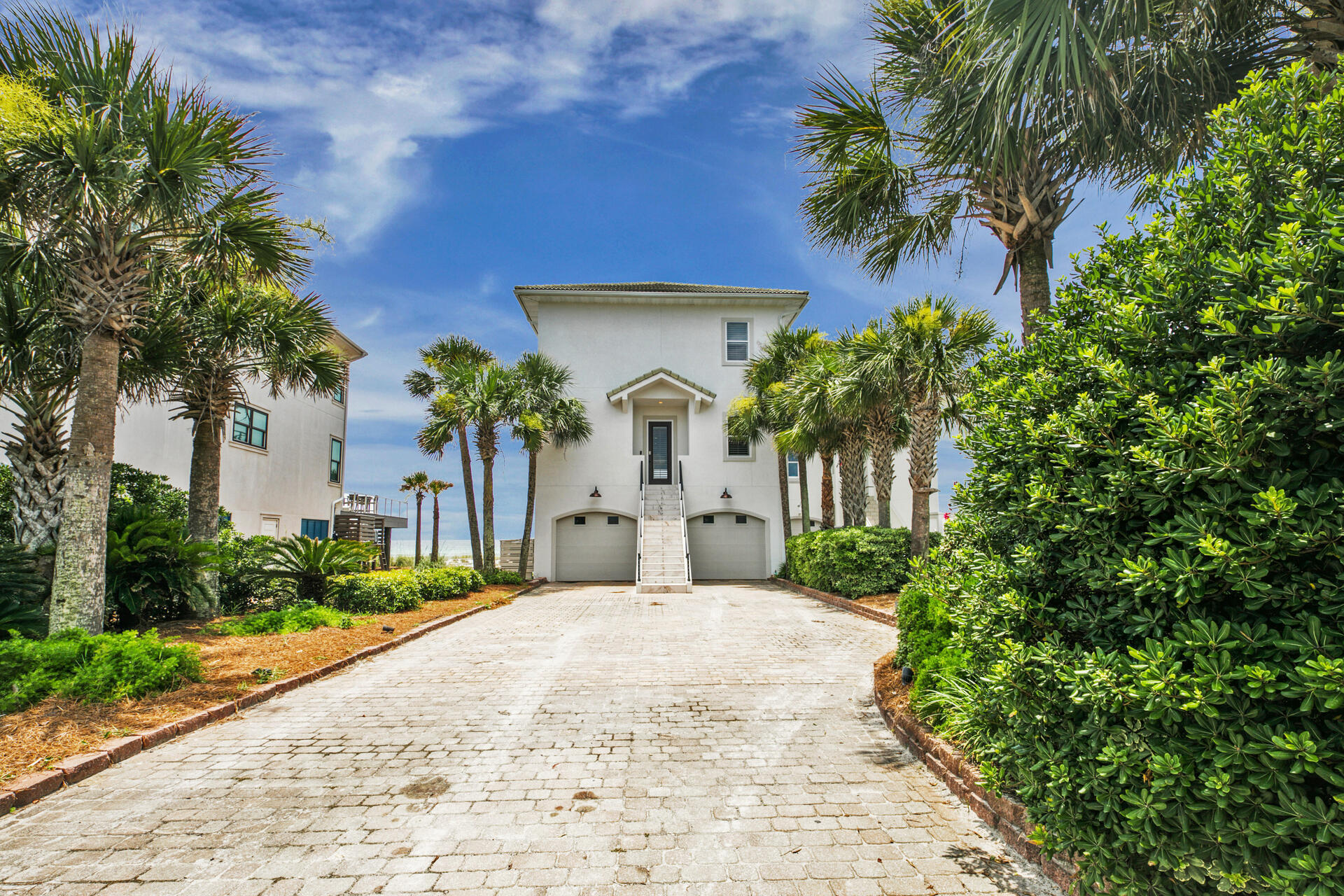 This stunning beachside home is primarily located on Miramar Beach, in-between 30A and Destin! As you enter the property you're greeted with a beautiful marble staircase giving you a modern luxury coastal feel. The exterior of this home recently received a full renovation, including new stucco,  tongue and groove solid wood ceilings, modern aluminum handrails and new balcony tile. This property also has a strong rental history with current bookings for 2021, almost $400K on the books for 2021! The home features multiple stories, which include 8 bedrooms and 6 full bathrooms to accommodate up to 26 guests! Updated kitchen photos and matterport will be uploaded no later than 07/12.