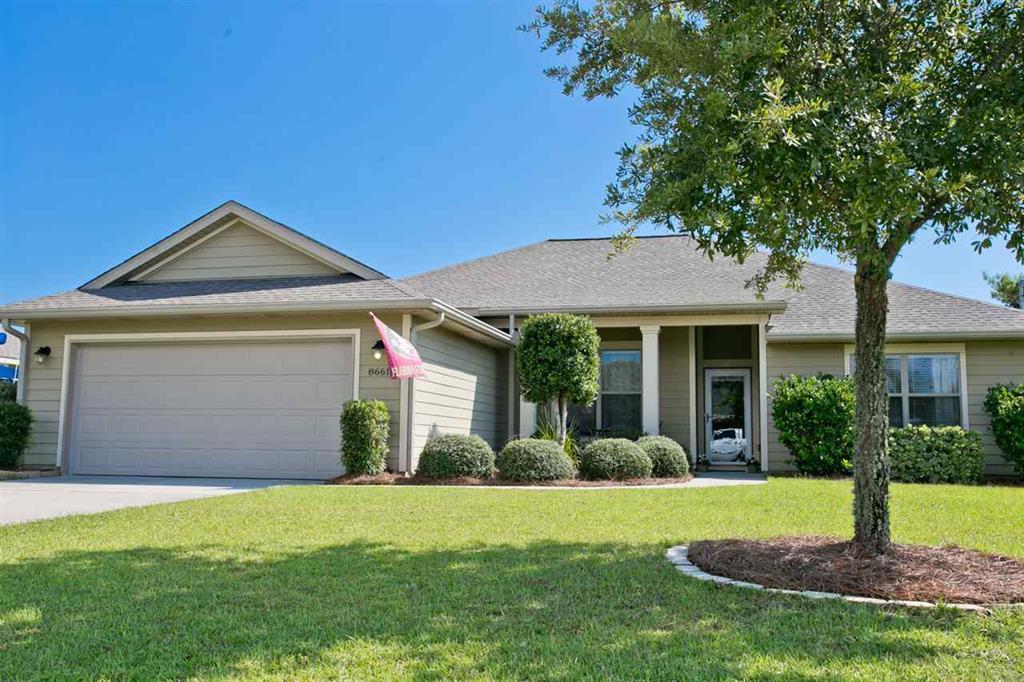 Lovely custom 4/2 home that boasts 10' ceilings in Great Room, Dining, Foyer, and Kitchen with Trey ceilings in master. Wall to wall carpet, with 17 tile in the breakfast, foyer, laundry room, kitchen, and both baths. Gourmet Kitchen with granite counters, maple cabinets with 42'' upper cabinets, large eat-in bar, breakfast nook, stainless steel appliances. Walk-in closets in 3 out of 4 rooms, with His and Her walk-ins in the Master. Fabric shield storm protection, front door features a storm door while French doors open to a beautiful back yard featuring a shaded Pergola over the patio, shaded play area & 6 person Caldera hot tub. 50' of natural uncleared yard full of mature trees in the LARGE, FENCED backyard. Over-sized garage! New grinder pump for sewer. Don't wait, Come take a look!
