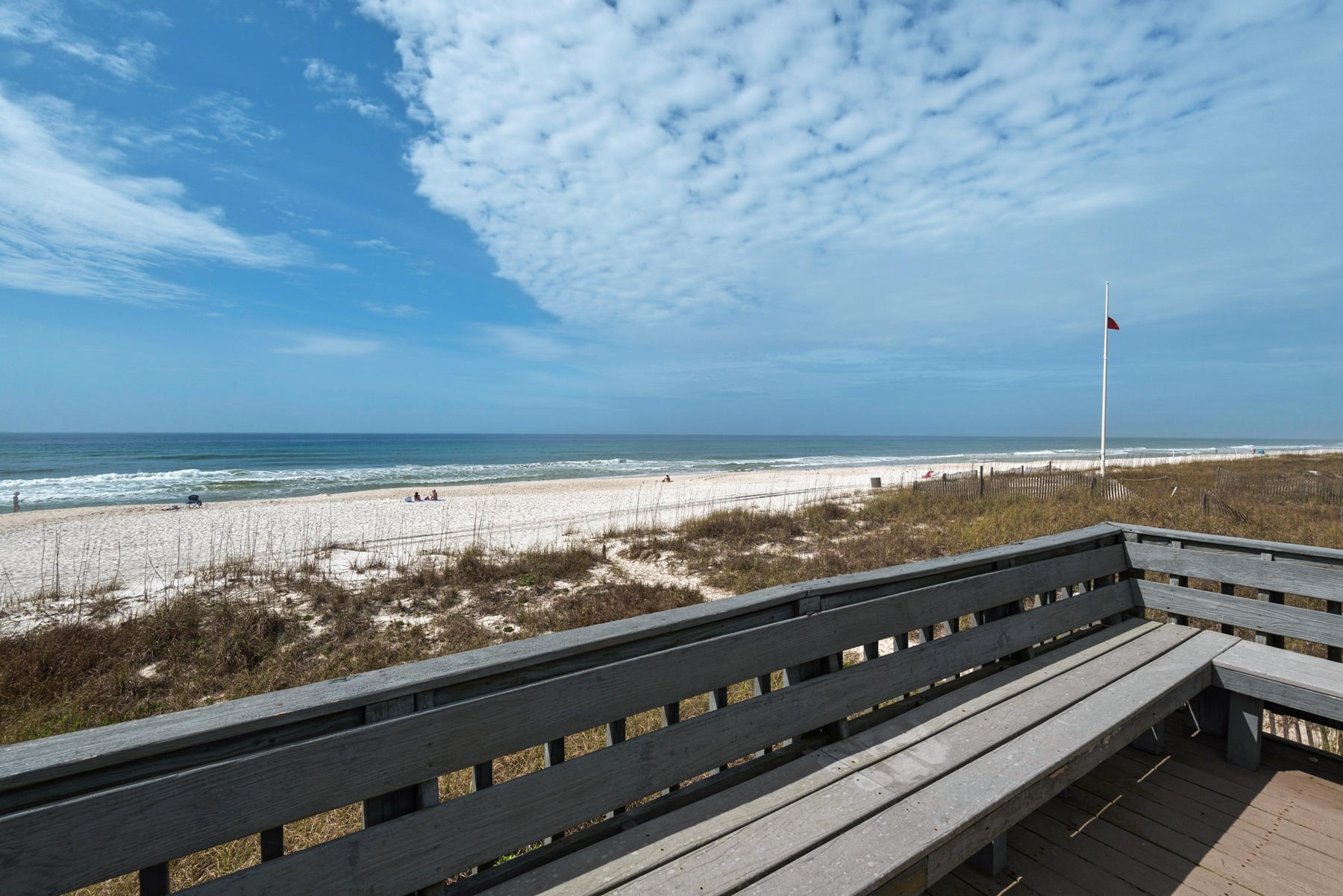 BEACH FRONT on highly sought after WEST END! The Coastal Charm and breath taking view will capture you with a welcoming warmth as you enter. You will be amazed at this spacious open living plan offering plenty of room for everyone to enjoy time together. There is a COMPLETE NEW KITCHEN as well as a large bar area with full size refrigerator and wine cooler, wonderful family dining area with buffet, and spacious seating and game area, all with incredible views of the water. Step out on to the luscious back lawn, chill out or grill on the comfortable deck area or relax on the observation deck as you energize yourself for a day at the beach. With 4 bedrooms plus a BUNK ROOM THAT SLEEPS 10 with separate seating and game space for the kids, you will find plenty of getaway space for large groups