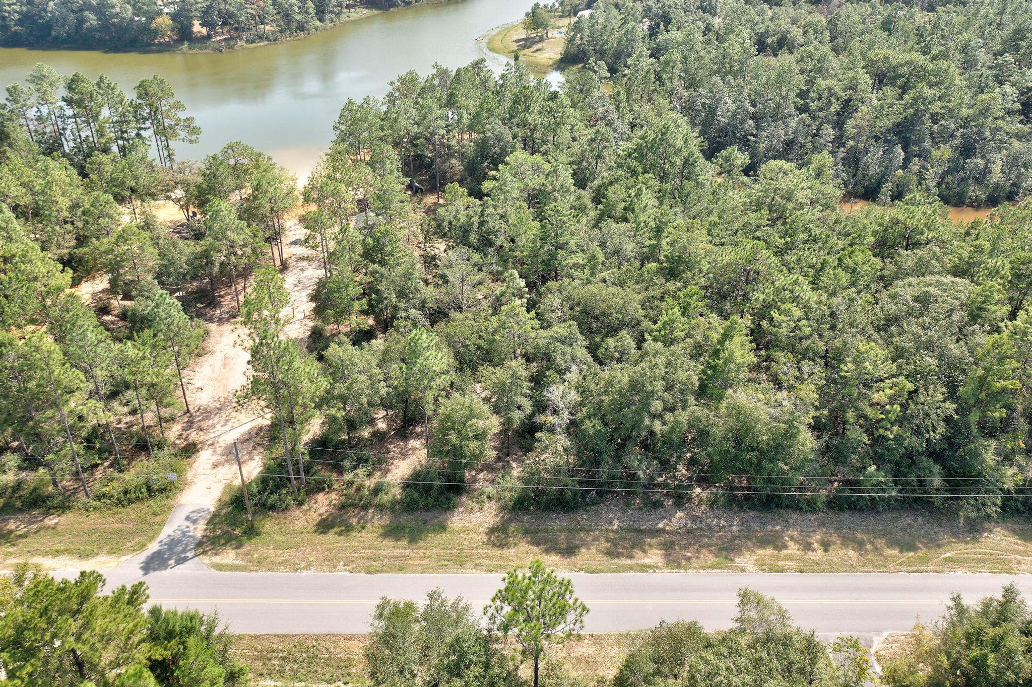 Discover the perfect spot to build your dream home on this peaceful lot, offering a tranquil retreat with a beautiful lake just behind the property. The land has been partially cleared, providing a head start for your building plans while still maintaining a natural landscape. This lot offers the ideal combination of serenity and potential, making it a wonderful canvas for your future home or getaway.