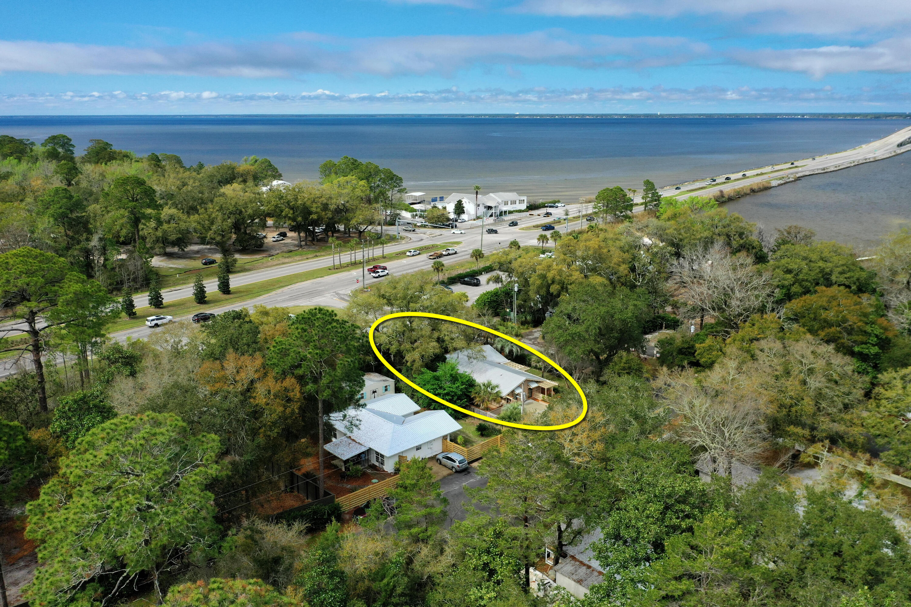 NEW LISTING! FURNISHED, TURNKEY OPPORTUNITY! A perfectly renovated and charming quintessential Florida style cottage located across from the Choctawhatchee Bay in South Walton County, Florida, only 5-miles to Grayton Beach, which has been voted the Best Beach in America for many years. Conveniently located on the corner of Bay Magnolia Lane and Cedar Street in Santa Rosa Beach, this gorgeous property is within walking distance to the new Pilcher Park for convenient fishing and boat launch, located just off the 331 bridge. This home's quality improvements project an unforgettable streetscape; from its artistically crafted fence to its lush landscaping accentuated by fabulous ambient night lighting, all sides of this cottage...