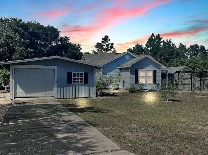 Back on market due to no fault of sellers! Turn key short term rental in the perfect location! Perfect for Air BnB! A mile from the nearest public boat ramp. Bring your boat, RV, or other toys. No HOA here! Home has two detached garages/workshops that are wired with electricity. Fully furnished with everything you need! Home is located on cul-de-sac street. Two bedroom with additional flex space for office or kids' bunk room and two full baths. Cathedral ceiling in living and dining room with tile throughout the whole home. Kitchen has pantry and lots of cabinets. Nice sized screened in patio on back of house. Landscaping features apple, avocado, fig, muscadine, blueberry, and other trees. HVAC 2007, roof 2012, water heater is newer. Schedule your showing today