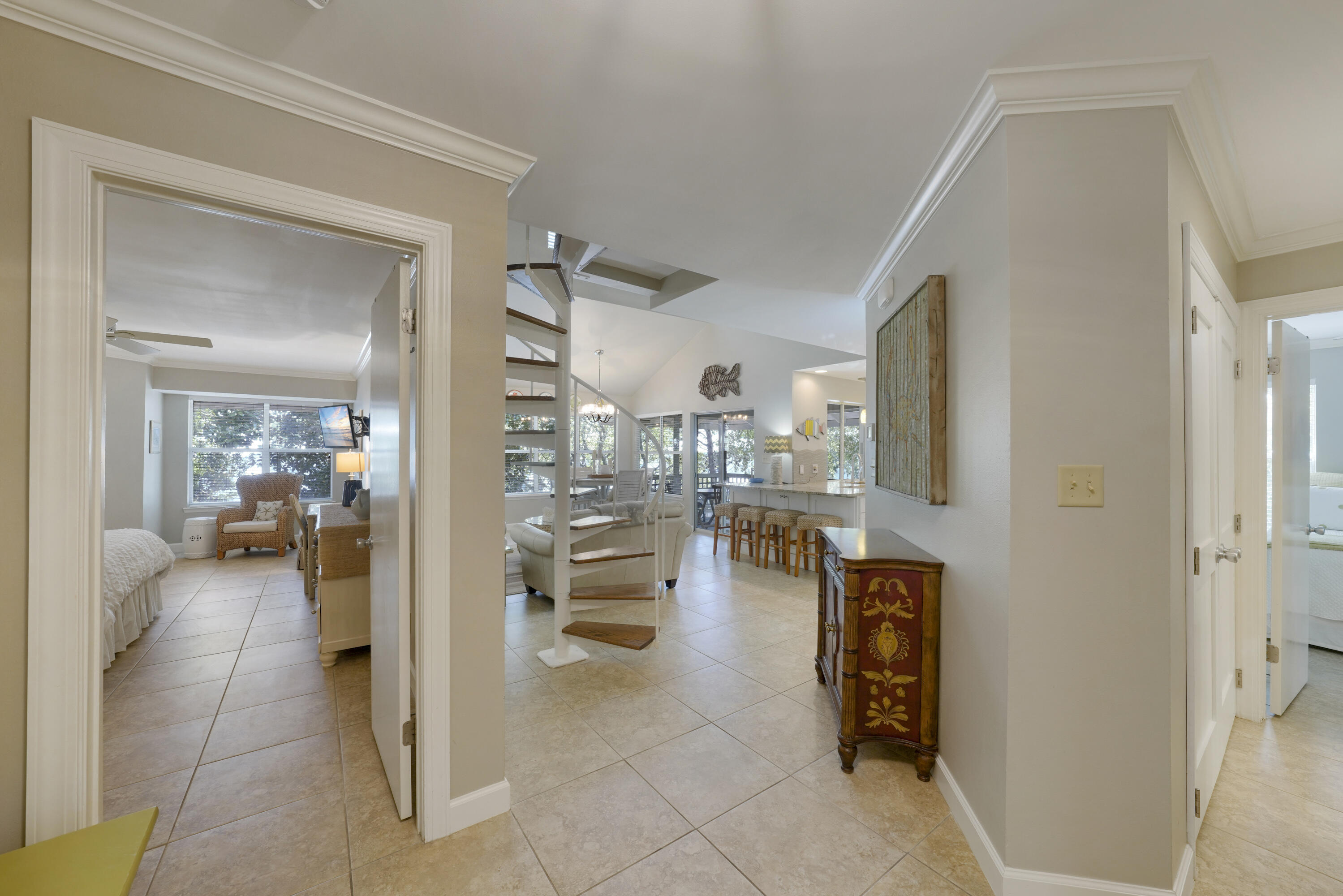 ***PREPARE TO BE AMAZED***COMPLETELY RENNOVATED AND BEAUTIFULLY FURNISHED ****GREAT INVESTMENT*** PRIVATE BEACH***GATED COMMUNITY ***RENTAL READY** Discover this stunning 3 bedroom, 3 bath Coastal Carolina style beach cottage, completely remodeled down to the studs for modern luxury. The home boasts new smooth ceilings, crown molding, replaced glass in all windows, and elegant tile floors on the main level. Each bathroom has been updated with new tile, plumbing fixtures, and vanities, ensuring a fresh and contemporary feel throughout. The kitchen footprint has been expanded to include additional storage and new tall cabinets, a beautiful wet bar with a wine and beverage cooler, and granite countertops. The loft area has been enclosed for added privacy. A motorized shade was installed on the vaulted ceiling window for easy operation. Although never in a rental program, this cottage is rental-ready and fully furnished with no deferred maintenance.
The spacious and open floor plan is flooded with natural light, showcasing fabulous furnishings and finishes, including new tile flooring, crown molding, updated lighting, and granite countertops. Step out to your generously furnished screened-in porch, complete with a flat-screen TV, and a breakfast bar. The Zen setting of this porch gives you the feeling of being in a treehouse, overlooking soothing grounds.
The large master bedroom features a walk-in closet and a completely updated en-suite bath with a walk-in shower. This cottage is ideally located, being close to the beach and just a short stroll to the tennis courts, community pool, gazebo, mailboxes, lighted basketball and pickleball courts, and a playground area. You'll also be near the entertainment venues of Sandestin, Silver Sands Outlet Mall, Publix, and Grand Boulevard.
Hidden Dunes is a private, low-density, gated beachfront resort spanning 27 acres with manicured mature vegetation, walking paths, lighted fountains, and pools. This development offers a professional tennis facility with six Rubico courts and a Proshop, in-season tram service, horseshoe pits, four pools, three hot tubs, BBQ grills, and 24-hour security. The private beach provides full beach service, and tennis enthusiasts will appreciate the seasonal tennis activities, tournaments, instructional programs taught by USPTA teaching staff, and matchmaking services.
This beach cottage is a rare find and will sell quickly. Don't miss the opportunity to make lifetime memories with family and friends on the quiet sugar sand beaches of Hidden Dunes. Hurry to secure your dream home today!
