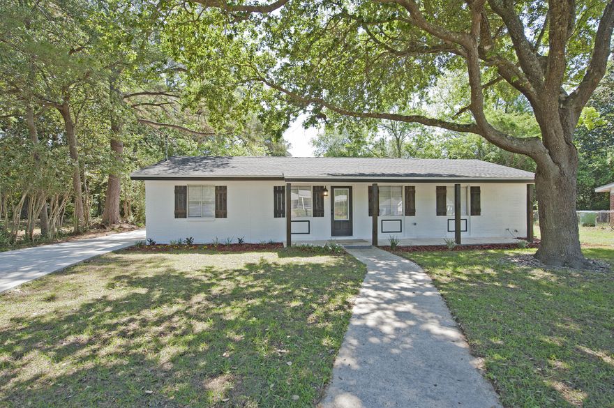 Revitalized 4 Bedroom, 2 Bathroom, 3 Living Areas, Quaint, Quiet Crestview Home.We've gone beyond renovation and into renaissance with this sizable home on an equally spacious .33 acre Crestview lot.Sure the fresh exterior paint, new roof and new shutters will impress as you pull up your large trailing driveway with rear carport, but the upgrades to your new home go beyond curb appeal. Stepping into the foyer, the open layout of the home and dark hardwood floors transition to the new tile of the kitchen. Brand new cabinets, granite countertops, Whirlpool electric range, and stainless-steel Samsung refrigerator are a few of the home's modern upgrades. The lines of the vaulted ceiling and open floor plan provide access to the living room and dining area with a fireplace focal point a