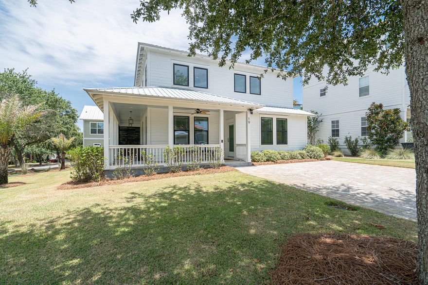 Under contract, but accepting backup offers. This better than new beach house is located less than 1/2 mile from the beach on a large corner lot in the gated community of the Village at Blue Mountain Beach.  You will love the large wrap-around porch with teak furniture and ceiling fans making it a perfect spot to sip your coffee in the morning. This home boasts an open floor plan living room, kitchen, and dining with upscale furnishings and finishes including large quartz island, soft close white shaker cabinets, SS appliances, and open shelving. Easy to maintain Luxury vinyl flooring throughout the home and a 1/2 bath off the living room for convivence. The first of two large master bedrooms is located on the first floor complete with large walk-in closet and ensuite with double quartz