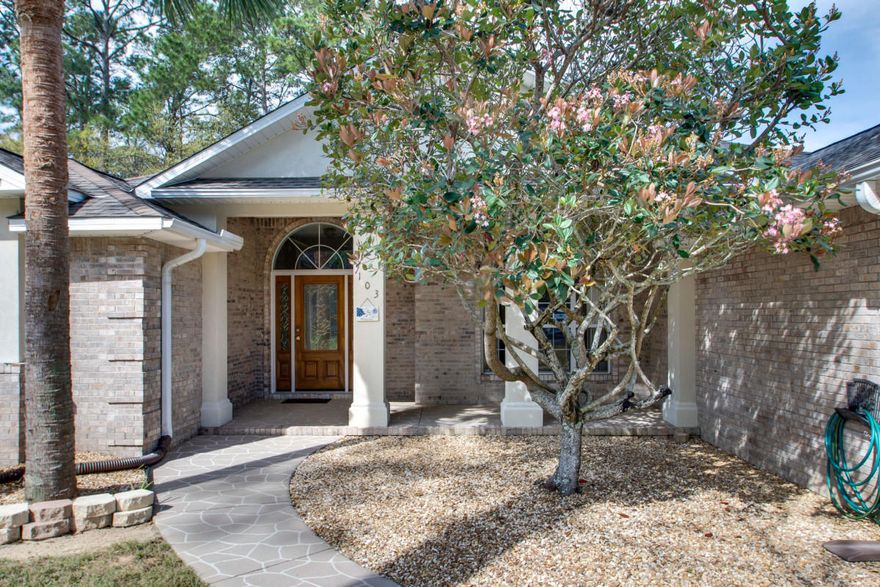 Wonderful family home in BayShore Place, one of Niceville's most desired communities. This original owner, immaculate former Parade of Homes listing is just minutes from Eglin AFB, regional airport and all Niceville schools. The quoins accented brick exterior split bedroom floor plan is spacious with well-designed living space. Exquisite teak floors, leaded glass front door and sidelights with large transom, crown molding, trey and cathedral ceilings set the character of this home. Fabulous renovated master bath, 42' upgraded natural maple wood custom cabinets with full granite throughout the kitchen area, and custom closets are outstanding features. Glass front cabinets, pan and pull out drawers, and a double oven highlight the kitchen. The master bedroom and bath include dual walk-in closets, a stone decked garden tub, walk-in stone accented shower with seat, and dual granite vanities.  A large family room with wired surround sound speakers, a gas fireplace and a breakfast nook support a leisure lifestyle.  Other remarkable features include tiled utility room, large attached two car garage, Rinnai continuous gas hot water, a new built-in natural gas Generac emergency power generator. The flagstone stamped front and back porches provide ample covered space for protected outdoor activities.  The back door access to bedroom and bath are well suited for a mother-in-law suite. One bedroom is office conversion ready.