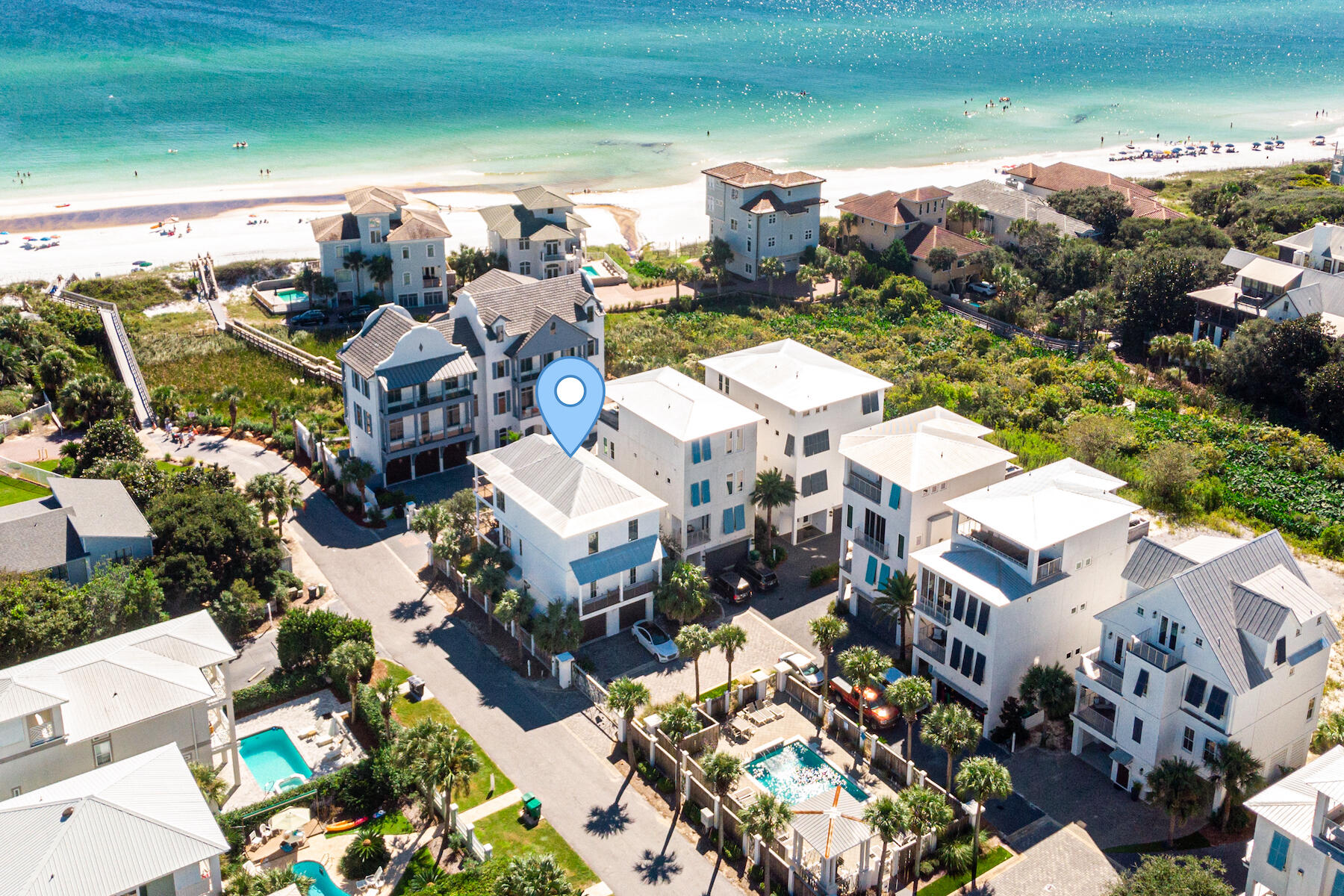 Luxury living awaits in this custom home by well renowned builder Cole Construction in the private gated neighborhood of Caspian Estates, South of 30A and just steps to the sand. Just under 1,000 SqFt of covered outdoor space, with Gulf Views from the second and third floors. A well designed floor plan with high end finishes throughout; oak and tile floors, Carrara Marble and Quartz countertops,  chef's kitchen with Sub Zero and Wolf appliances, a wine refrigerator and double oven, living room gas fireplace, over-sized two car garage, fenced backyard with low-maintenance turf, abundant storage, two laundry rooms, bedrooms and bathrooms on all three levels. Look no further, this is the one! Rental projections of just under $300,000, this home is sold fully furnished and rental ready.