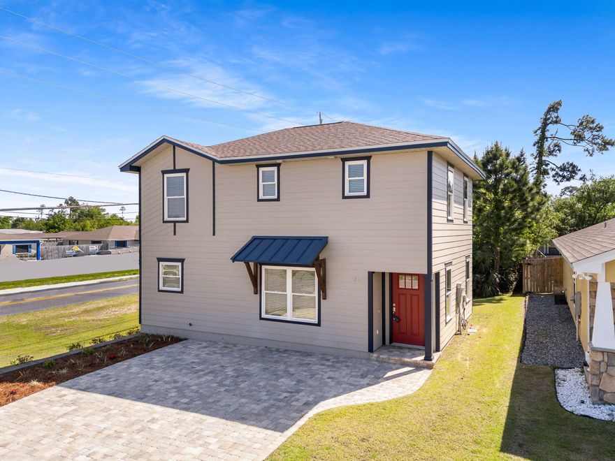 Welcome to 2601 Ashlee Way, a beautifully crafted new construction home located on a desirable corner lot in the heart of Lynn Haven. With 3 spacious bedrooms and 2.5 baths, this contemporary home offers the perfect blend of style, functionality, and value. Better yet, there is no HOA and it is located in Flood Zone X, where flood insurance is not required. Step inside from the beautiful paver driveway, and you will immediately notice the open-concept layout, ideal for both everyday living and entertaining. The kitchen flows seamlessly into the living and dining areas, featuring custom wood cabinetry, recessed lighting, and a thoughtfully placed half-bath for guests just off the main space. Upstairs, you'll find all three bedrooms, including a generous primary suite and two full bathrooms, offering comfort and privacy for the whole family. The exceptional craftsmanship continues with custom wood cabinetry throughout the second level which is a feature that sets this home apart from standard builds. 

Out back, enjoy a spacious deck perfect for grilling, relaxing, or hosting friends. With minimal yard maintenance, you will have more time to enjoy everything this vibrant area has to offer. 

Located just minutes from grocery stores, shopping, dining, and the best of Lynn Haven and Panama City, this home is all about convenience and quality. Don't miss the chance to own a new custom-built construction home in a prime location for under $300,000. This isn't your average new build. Come see the difference for yourself. Schedule your private tour today!