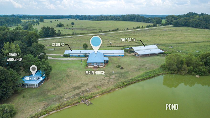 Accepted offer but buyer & seller agreed to allow to market for back up offers! You still have a chance to make this beautiful Equestrian Estate yours! There are 34 acres & includes the custom move-in-ready main house (built in 2009) with three bedrooms and two bathrooms split bedrooms and open floor plan totaling 1800 sq ft and the guest house with one bedroom and one bathroom with 880 sq ft. Both have screened porches with phenomenal views of the 3 acre spring-fed pond and pasture land! Amenities include: a 22 horse stall stable, large workshop with roll door, hay barn (new roof), covered RV Barn with all utilities, arena and so much more! All 3 pastures have 300 gallon water troughs w/ auto-water and are fenced and cross fenced.