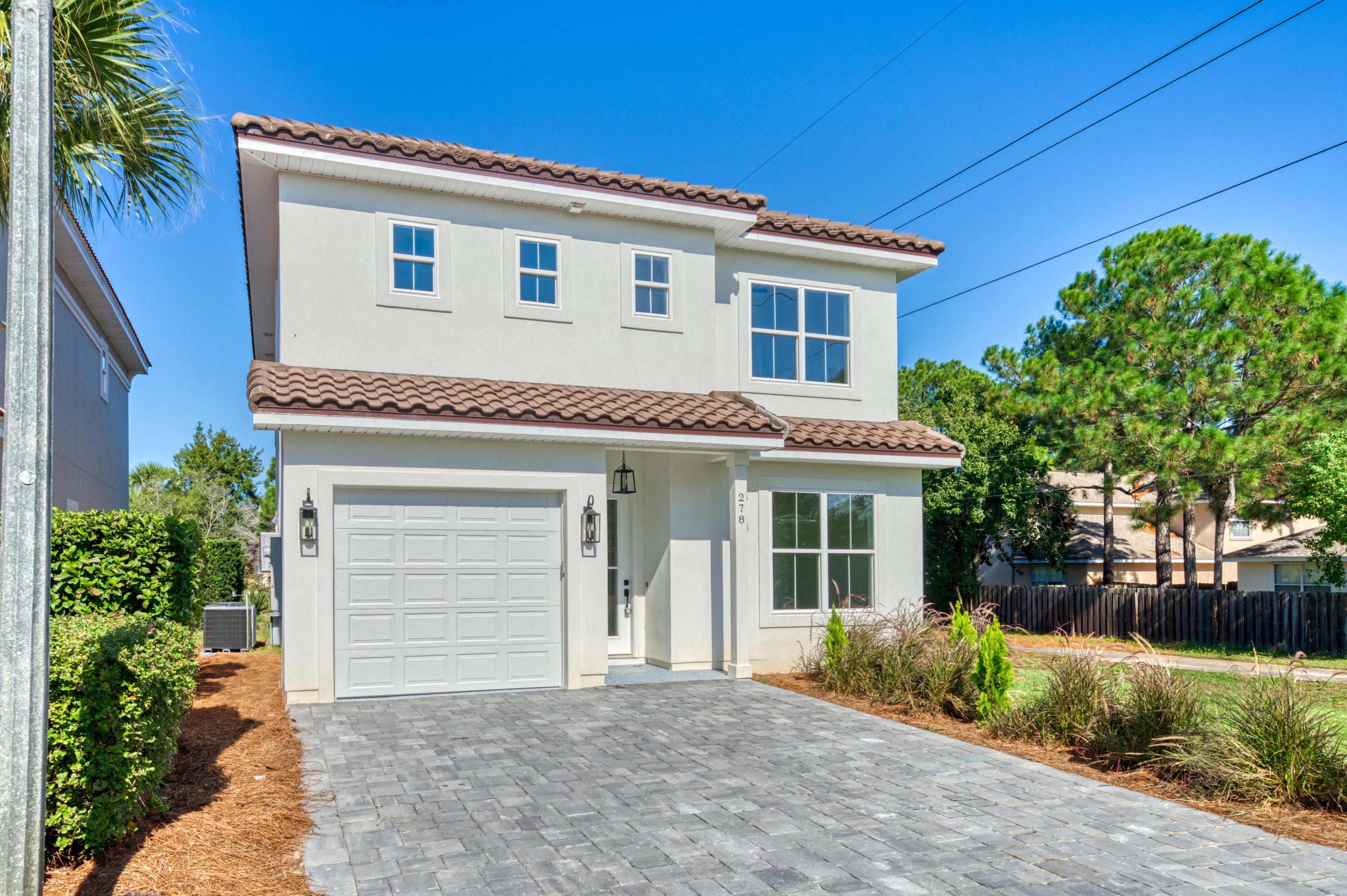 Coastal elegance is calling in the heart of Destin with this new, pristine, contemporary build on a quiet corner lot nestled in the gated community of Calusa Bay. Adorned with quartz counter tops, a gas range and cooktop, tankless water heater, vinyl plank floors and all En Suite bedrooms complete for the perfect full time residence retreat. This lot can accommodate the addition of a private pool and spa while overlooking a serene lake with privacy adjoining a walking path. Avid golfers will love being prestigiously positioned between Emerald Bay and Regatta for those early weekend tee times. With easy access to many restaurants, shopping and a short drive to the beach; you don't want to miss this opportunity to carefree beach living!