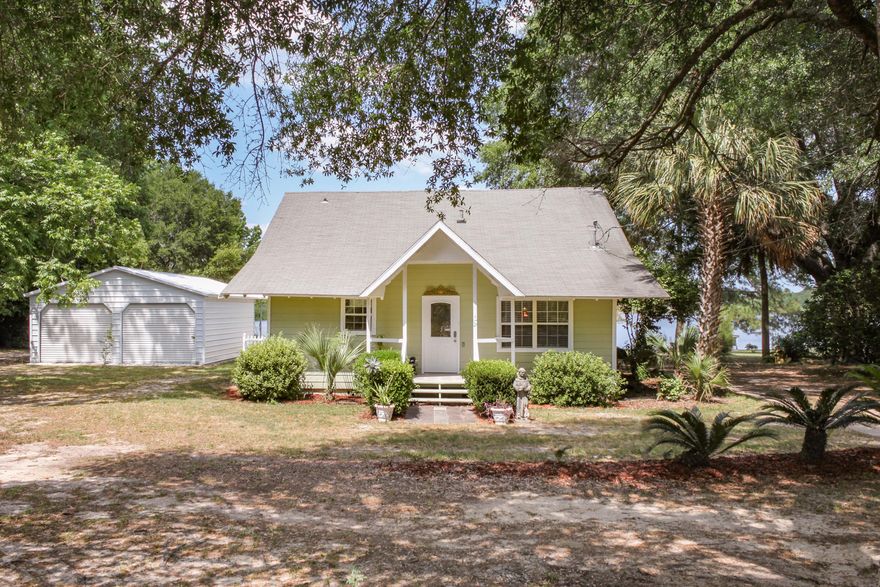 Historic Florida Cottage on Lake Stanley. Check out this beautifully renovated 3 bedroom 2.5 bath Lake House with 245 Feet of waterfront and a dock. This home has been recently renovated including hardwood floor refinished, Brand new wiring through out entire home (March 2017), brand new HVAC unit with new ducting (March 2018), and new paint just to name a few improvements that have been done. Double car garage metal building that's only a year and a half old. Lake Stanley allows for motorized vessels so its perfect for a day of skiing or tubing. Home has a very nice sandy beach area down by the dock. Why buy a home that needs renovations when this one has had all the hard work done! Call today to schedule a tour.