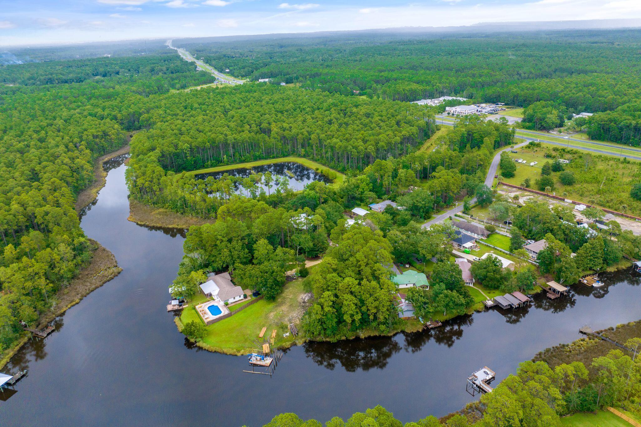 Large waterfront lot on Mallet Bayou. Located on cul de sac which enhances the already private setting. Just minutes to the beaches to the south or Publix and Freeport to the north. Great opportunity to build your waterfront home in an ideal location. Lot has been cleared and is ready tp build om which adds to value.
