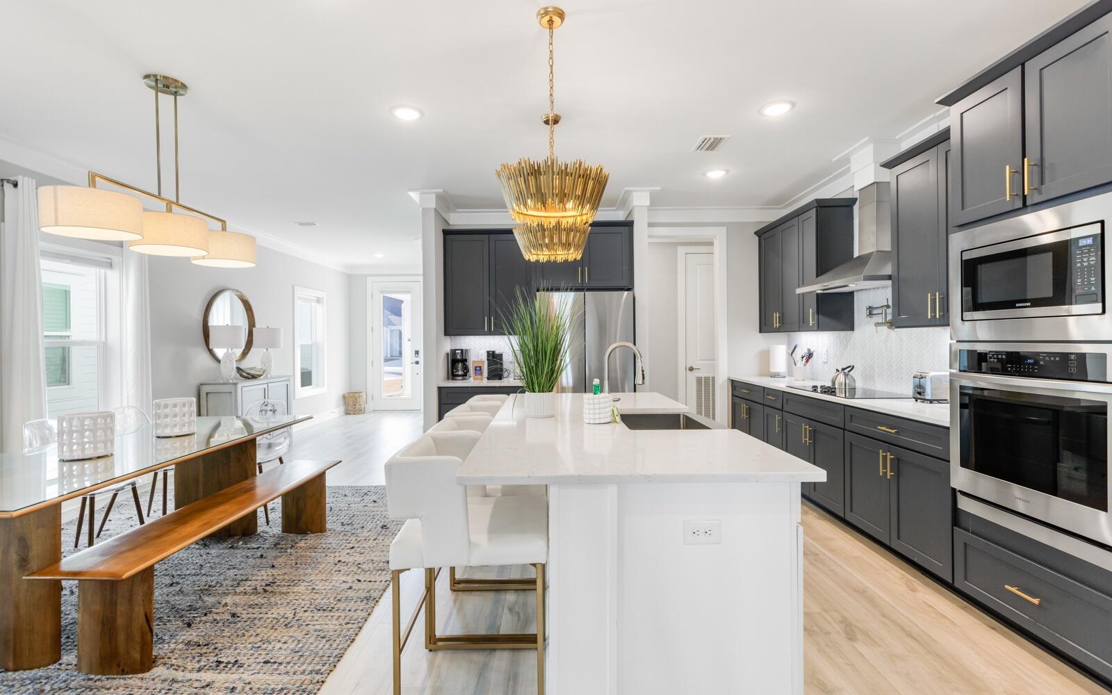 This stunning, highly-upgraded, one-story, 2023-built beach house offers a contemporary vibe, comes fully furnished and is located in the highly desirable west end of Panama City Beach, Florida and just minutes from Scenic Highway 30A. This impeccably maintained property offers 2,015 square feet of living space, featuring four spacious bedrooms and three luxurious bathrooms. Situated in a newer, low-density community, The Preserve at Lake Powell, this home is perfectly positioned in a cul-de-sac, providing a peaceful and private setting. Upon entering, you will be greeted by high ceilings and a thoughtfully-designed split floor plan of this single-level home. The large kitchen island is a dream for entertaining. The upgraded appliances-including a gas cooktop, Quartz countertops, pot filler, apron sink and walk-in pantry make the kitchen a chef's delight. RevWood throughout, designer lighting, tiled showers and high-end furnishings add a touch of elegance throughout the home making this a desirable rental to your guests enhancing your investment even more! At over $65,000 in rental projections - this would be an ideal place for your next investment at the beach!
The primary suite is a true retreat. Peaceful and serene, you'll enjoy a custom grasscloth accent wall and direct access through the suite to the screened-in porch. The primary suite bathroom is spacious and boasts excess counter space, double vanities, large-tiled shower and a walk-through access from the walk-in closet to the laundry room giving convenience and functionality.
The home is fully furnished and turn-key, making it ideal for short-term rentals or a ready-to-move-in family residence. The fourth bedroom is being utilized as a bunk room and provides additional sleeping space, perfect for guests or children. The screened-in back porch offers a serene outdoor living area, perfect for enjoying the beautiful Florida weather year-round. The back yard is fully fenced so great for dogs and children to play. You'll enjoy grilling on the grill provided and the screened-in patio making it an outdoor living area everyone will want to gather!
You'll also have peace of mind with thoughtful construction and design including a 2-car garage, spray foam insulation, EV car charger in the garage, dimmer switches, aluminum gutters, screened enclosure on porch, epoxy concrete floor in garage and knowing the home is pre-wired if you choose to add a generator.
Located just minutes from the white sandy beaches and the shores of Lake Powell, this property allows you to enjoy the best of coastal living and is ideal for an investment property for short term rental, a weekend getaway as a second home or an incredible full-time residence. The community is golf cart friendly, and you can easily walk or ride to Publix, restaurants and shops. The proximity to 30A is also incredible giving you access to shopping boutiques, restaurants, dining, and parks ensuring you and your guests have everything you desire when staying at the beach in reach!
Enjoy kayaking, paddle boarding or boating around Lake Powell, the world's largest Dune Lake, that is just steps from your front door. This amazing location is prime and you'll enjoy more than just the beach while you're at home! Head just a few minutes further west and you're at Camp Helen State Park which offers walking trails, biking trails and direct access to the sugar white sandy beaches. Alys Beach, Rosemary Beach and Inlet Beach are all just a short drive and in around 5 minutes, you're in the heart of it all.
This highly upgraded home is designed for making memories, whether you are looking for a permanent residence or a vacation rental. Don't miss the opportunity to own this exquisite property in one of Panama City Beach's most sought-after locations.