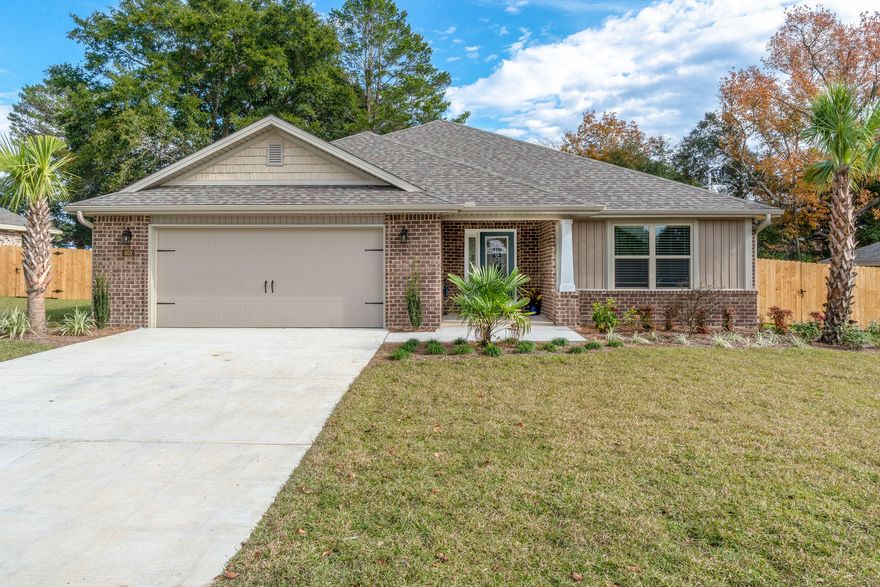 Make sure and ask your agent to send you the Matterport 3D tour. New construction in the heart of Fort Walton Beach is a rare find! This cottage style home is virtually maintenance free with its tasteful mix of brick and board and batten siding. From the moment you enter through the front door you will notice the detail this home has to offer. The large foyer finished out with modern 12x24 porcelain tile that leads to the family room which features double tray ceiling with indirect lighting and wide plank laminate flooring. The kitchen looks into the living room and sure to please the chef in the family with its rich cabinetry, sleek granite, and stainless steel LG appliances. The master suite is quite large. The master bedroom has 12x24 tile and a tray ceiling. It has a pleasant
