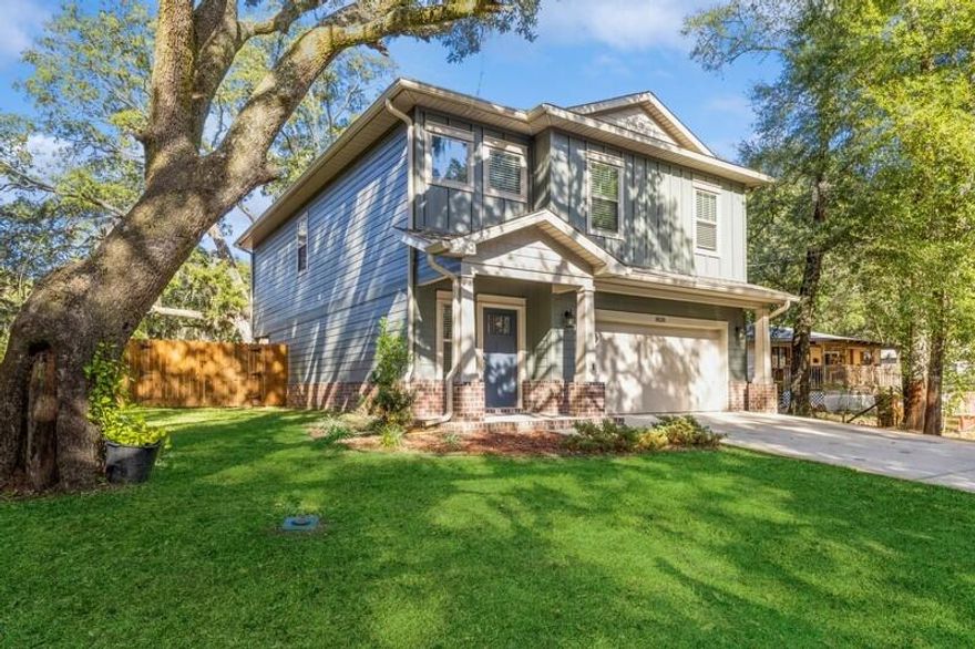 Dream Home Alert! Welcome home to this desirable Holley/Navarre area, minutes from the beach and quick access to the East River boat ramp. This stunning 4-bedroom, 2.5-bathroom craftsman-style home offers 2,156 sq ft of thoughtfully designed living space. The kitchen features granite countertops, stainless steel appliances, and a spacious island, perfect for entertaining. The primary suite is a private oasis with a large walk-in closet and an en-suite with a soaking tub and separate shower. High ceilings and natural light create an inviting atmosphere, while the privacy-fenced backyard and covered patio provide ideal outdoor spaces for two or four-legged family members. Enjoy the beautifully landscaped yard with mature trees. No HOA; you'll have the freedom to make this home your own.