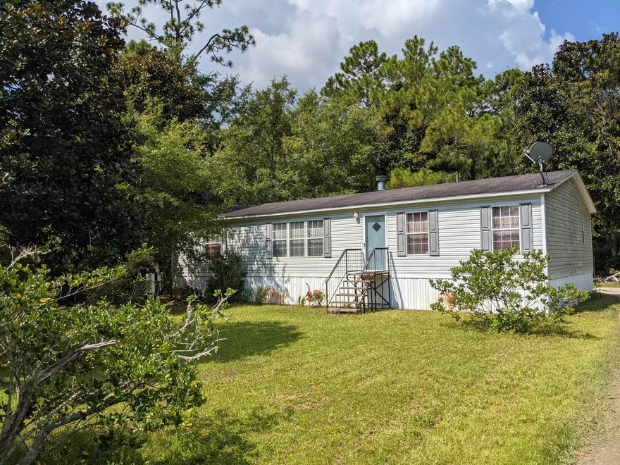 Three Bedrooms and two bath home on elevated foundation. Wide open living room and kitchen areas. Big master bathroom with double vanity and jacuzzi. Large open deck and lots of beautiful trees on the lot. Close to a boat ramp to the bay and a few short miles to the gulf of Mexico.
