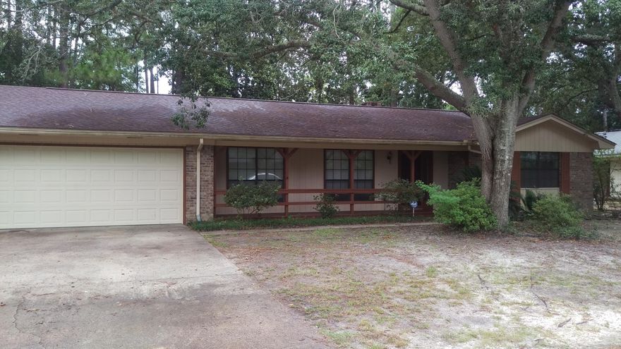 This is a nice family home in the cozy community of Pinewood Estates. The home includes three bedrooms, two bathrooms, and two living areas. The family room includes wood plank flooring, a fireplace, and French doors that lead out to the new deck. The breakfast nook, located between the garage and kitchen, includes a large laundry closet and overlooks the backyard. The front bedroom has two large closets with enough room for just about any wardrobe. The Master bedroom has two closets and includes sliding doors that lead out to the backyard deck. Seller will provide home warranty for buyers peace of mind. Recent improvements include 2012 roof, new deck 2015, new microwave 2016 and recent garage door replacement. Call for your tour today of this affordable home in Niceville