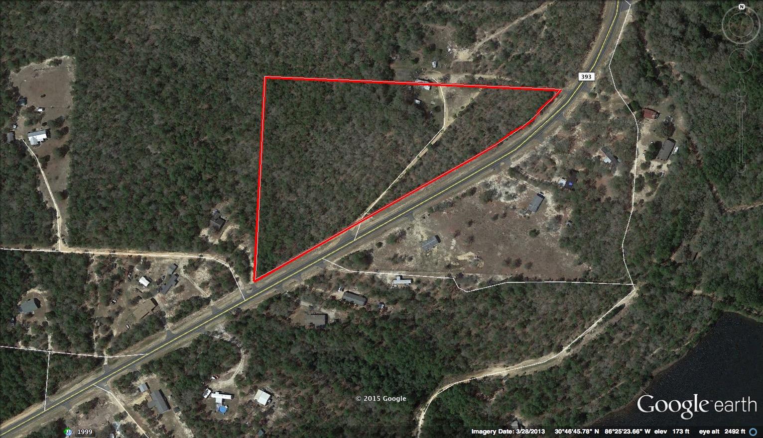 10.07 Acres paved county Highway 393! Big trees lots of paved road frontage. Auburn Water system, Power available.