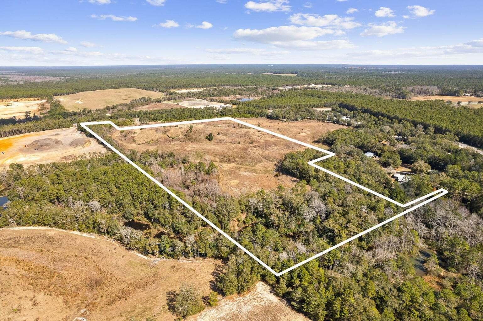 Hwy 20 Frontage!!! Currently zoned Rural Village and zoning allows for up to 12,000 sq ft commercial building. Parcel can be split. Pretty trees to provide some shade. Potential use RV park, business to enhance rural village life. Paved entrance and gated.