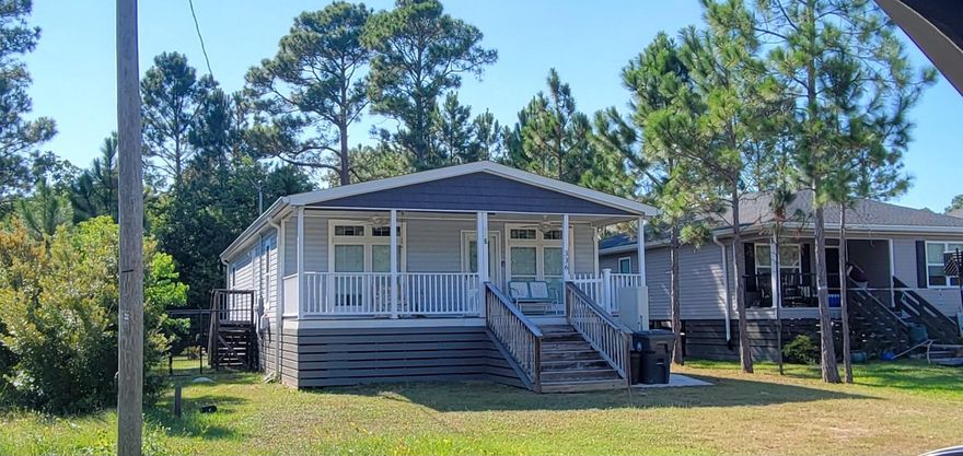 Adorable 3 bdrm, 2 bath, 2019 Modular home at the end of Santa Rosa St in the up and coming Town of Santa Rosa subdivision... Enjoy mornings and evenings on your covered front porch with fans turning and birds chirping only a few miles from the white sand of the Emerald Coast beaches & even shorter distance to the beautiful Mussett Bayou and the Choctawhatchee Bay. Fenced dog run. No HOA