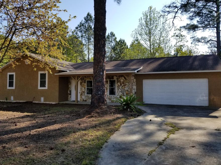 3 lots together give this property a very nice size yard, peaceful neighborhood and large yard make for a comfortable environment. 3/2 house has good bones and can be a wonderful first home or long term rental property. Beaches are a couple miles to the south and great shopping is at Sandestin area. Less than 1/2 mile to Cessna Landing boat launch on Hogtown Bayou. Home has just been completely repainted on outside and screened porch on back has a new ceiling.