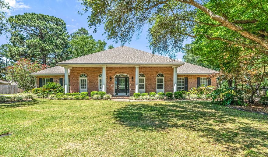 Beautiful Colonial Style POOL home in the desirable neighborhood of Rocky Bayou Estates. This home features a split floor plan of 3 bedrooms and 2.5 bathrooms PLUS an office with French doors in just over 2,600 sqft. of living space. As you enter the home you will notice real hardwood floors, crown molding in the entire home, a gas burning fireplace, and tall ceilings. The formal dining room has wainscoting trim. OVER-SIZED kitchen with center island creates an inviting gathering space for all your social events. Kitchen includes large breakfast bar with pendant lights, GRANITE counter tops and a breakfast nook. The master suite is private and has an en-suite bathroom with walk-in closet, separate shower and tub, & dual vanities. The additional bedrooms provide ample space for large