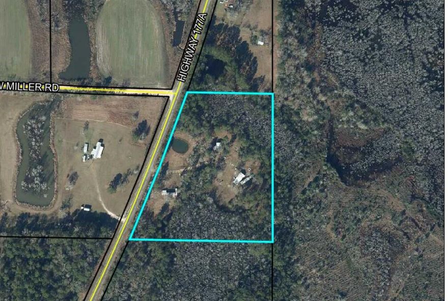Whether you're looking for a place in the country with plenty of elbow room or or investment for rentals, this 8 acre parcel may be just what you've been looking for.  Many possibilities.  Property has one mobile home newly remodeled and  ready to move in. There are two other mobile homes on property needing work.  They could be renovated for family member or rentals. There are two septic tanks and two working power poles. One well.  Paved road frontage.  Fish pond.  Barn has electric and water. Plenty of room on this 8 acres to start your mini farm, rental property, or quiet get away and slower paced country life!