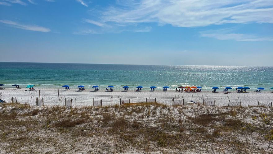 IMMACULATE & PRISTINE gulf front condo with amazing GULF VIEWS!  This large 2br/2ba unit makes for the perfect investment property, vacation home, or year-round living.  Inside, you'll find a spacious U-shaped kitchen with stainless steel appliances, breakfast bar, upgraded cabinetry, and granite counters. Off the kitchen is a large closet that doubles as a pantry / laundry room. The dining & living space is open so one can enjoy gulf views from all angles. Beautiful wood-look tile flows throughout the common area. Crown molding throughout, and no popcorn ceilings! New HVAC & Hot Water Heater. New large sectional sofa in the living room, allowing plenty of seating. GULF FRONT MASTER SUITE has large walk-in closet & private bath w/ walk-in shower and newer vanity & fixtures. The guest bedroom is spacious & comfortably holds 2 queen beds, accommodating 4 guests for max rental income. Carpet replaced in 2018. Shared full bathroom was also recently upgraded with newer vanity, mirror, plumbing & fixtures and has a tub/shower combo.

Expansive gulf front balcony is larger than most units on the island! Relax and enjoy the beautiful 3rd floor views of the sand and surf. Hurricane shutters installed for additional privacy / protection.

Surf Dweller features over 400ft of beach frontage, community pool w/ sundeck, kiddie pool, picnic area, covered parking (first come first serve), fitness center, elevators, and tennis/pickle ball.  HOA dues currently $2,345.86/quarterly.

Water Heater 2021, HVAC 2022. Unit to be sold AS IS.