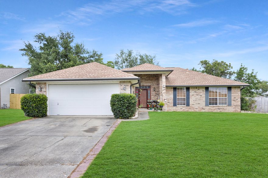 This all brick well maintained home on a large FLAT lot offers an open floor plan and split bedroom design. The living room features a vaulted ceiling, and kitchen has stainless steel appliances PLUS a pantry! The master bath features a huge all tile spa shower, double vanity, and a large walk in closet. NO CARPET in this home! Both storage buildings to convey. Seller willing to transfer the Platinum plan with Select Home Warranty (expires on 07/06/2024). This home is situated South of I-10. Only 10 miles to 7th Group and 20 miles to Eglin Air Force Base.