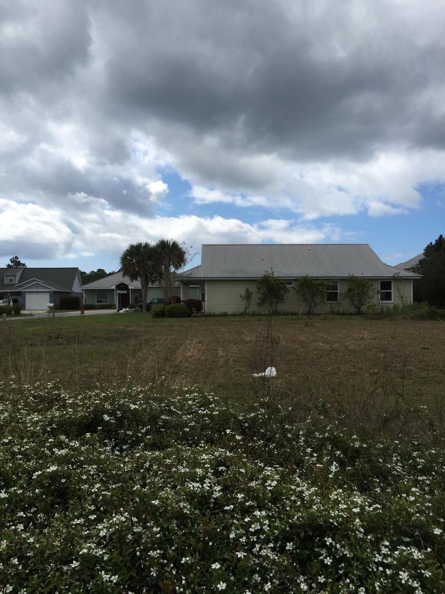 This lot is located on the south side of Hwy 98. The subdivision sits in the middle of three manmade lakes that are owned by Pickos Waterski & Wakeboard School. No HOA's! Great corner lot to build your dream house.