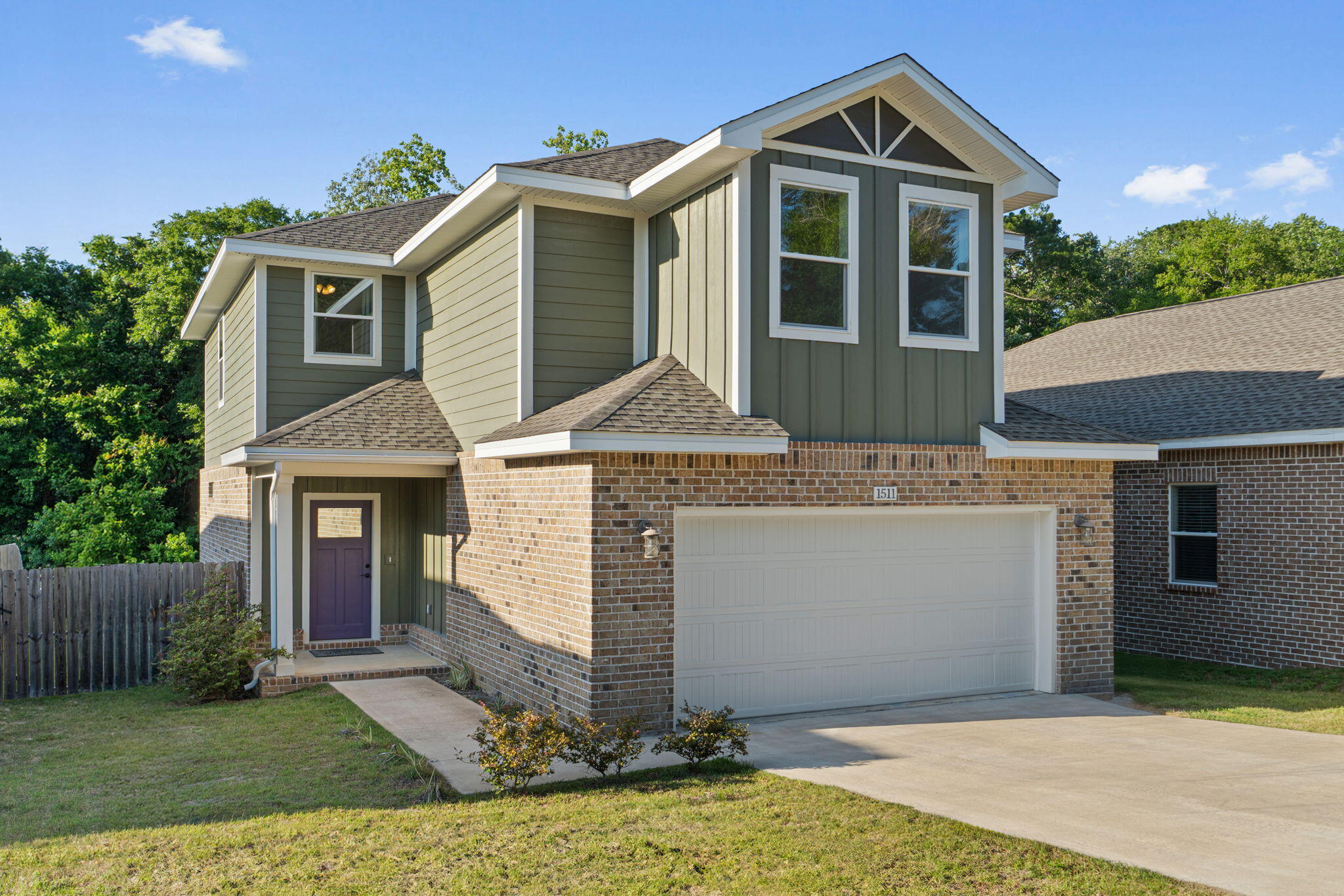 THE Niceville home you have been looking for! 1511 23rd St has been lightly lived in and meticulously maintained since being built in 2022. This home offers 4 bedrooms, 2.5 Baths, spread over 2,304 sq ft, and a spacious 2 car garage. The location couldn't be better being minutes from the back gate of Eglin AFB, Shopping, Niceville High School, and some of the best Restaurants in the area. Upon walking in, you are welcomed by the large open windows that radiate throughout the downstairs living room and kitchen. The Luxury Vinyl Flooring covers the entire main area with Crown Molding throughout as well. The living room, dining room, and kitchen all work together, creating an inviting area. The Stainless-Steel Appliances with the Gold Accented Faucet and Cabinet Pulls add that extra POP to the kitchen. The extra tall cabinets with the Granite Countertops that stretch around to a convenient Breakfast Bar will be the place to hang out for all of the gatherings. The laundry and half bath with matching accents are both conveniently located downstairs as well.
The 3 bedrooms upstairs are all generously sized with large closets. The end of the hallway offers an area for a relaxing place to read, an office, or playroom. The Primary Bedroom and Bath say it all! 2 closets located in the bedroom and another one in the bath room. The Double vanity, Beautifully tiled flooring that leads into the shower with a glass door offer and a tub offer that touch of luxury you have been looking for after a long day.
The covered back patio leads to your spacious back yard with a privacy fence on 3 sides and a natural line on the back side that leads to a stream. This is the house you want to call home in the heart of Niceville with all of benefits without an HOA.