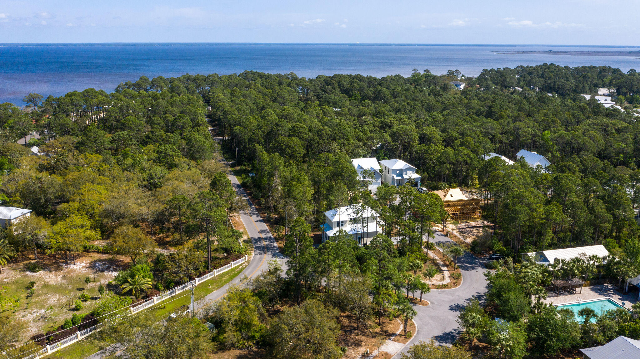 Builders Dream! Recently cleared with architectal floorplans included makes this lot a gem! Hidden Grove is a charming southern cottage inspired neighborhood that offers excellent amenities, southern charm and a centralized location in Santa Rosa Beach. Hidden Groves architectural design requirements and location make it the ideal community to build your primary or secondary home in. Neighborhood features include a large community pool with bathroom, pergola, chairs and tables, secure gated entry, lighted sidewalks and a pet waste station near the community mail center. Hidden Grove is within A1/2 mile walk or bike ride to the bay where you can fish or launch a small fishing boat and only minutes from Sacred Heart Hospital, Grand Blvd, Sandestin Golf and Beach Resort and the beaches