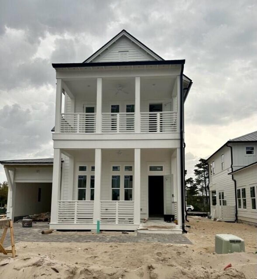 Experience the Epitome of 30A living at Bluewater Landing with the elegantly crafted Laguna plan. Immerse yourself in luxury beach life with this 3 bedroom 4.5 bathroom home that spans 2884 sq ft. This home features elevated 12 foot ceilings on the first floor, a gourmet kitchen equipped with KitchenAid appliances, 8-ft Solid core doors, elegant quartz countertops and wood floors throughout. Enjoy tranquil mornings on the charming front porch or breathtaking sunsets from the balcony. This home perfectly captures the essence of a beach cottage, while its location in the picturesque Blue Mountain Beach allows easy access to world-class beaches, dining and shopping