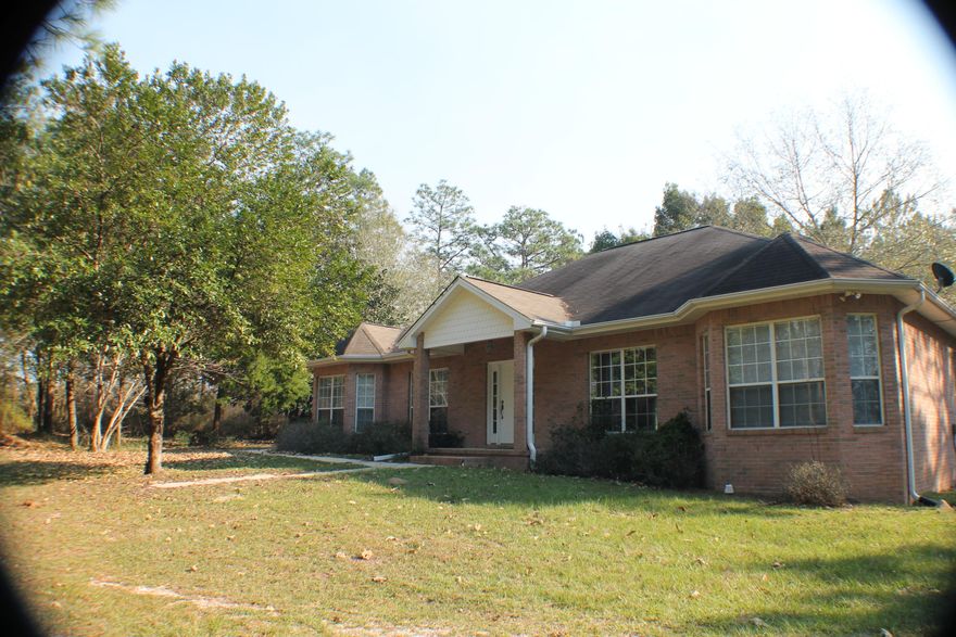 Country living at it best! Huge rooms, Quality Custom Tew Construction! Corner fire place, nearly two acres! Deep well ,rear entry garage! Th huge florida room has lots of sun-light and room to Relax! Bring your horse , your family to Mountain City Road today! Black water forrest is close fro thousands of acres of horseback riding ! Wow ! Paved road, Blackman Water is available and a Fire Hydrant is at the driveway! Relax in the Country today!
