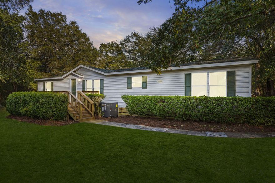 Situated on two serene acres, 563 West Bach Dr. offers the perfect blend of country charm and modern comfort. This beautifully renovated double-wide home has been thoughtfully updated from top to bottom, giving buyers the rare opportunity to enjoy rural living while remaining just minutes from town, shopping, and local attractions. Inside, you will find a spacious open layout filled with natural light and enhanced by fresh interior paint, LVP flooring, and new carpet. The kitchen has been completely revitalized with brand-new appliances, custom countertops, and stylish new cabinetry, while a custom backsplash adds a touch of elegance. Both bathrooms feature updated plumbing, upgraded fixtures, and a stunning custom tub with tile surround, creating spa-like retreats for relaxation. Throughout the home, new doors, trim, and hardware add a fresh, modern feel, complemented by updated lighting and electrical upgrades that bring both function and style. Comfort is assured year-round with a new HVAC system and water heater, while new drywall and siding improvements provide lasting quality. Step outside to enjoy a brand-new front deck, fresh exterior paint, upgraded windows and sliding doors, and landscape enhancements that make the property both inviting and functional. Whether you are looking to garden, entertain, or simply soak in the peace of your private acreage, this property offers the space and versatility you have been searching for. With every major system and finish carefully renewed, this move-in-ready home captures the best of country living and convenient to everything you need. The photos provided are virtually staged to help you envision how easily this home can match your lifestyle. 