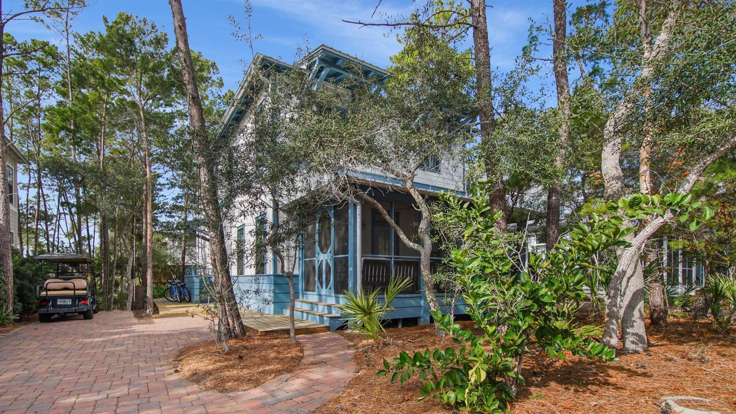Magnolia Cottages Phase 2, only 37 lots, lush landscaping with brick paver streets. Enjoy this coastal living home featuring gated beach access with golf cart parking. The house is conveniently positioned across from the large neighborhood pool and neighborhood park. The home has a strong rental history. This luxury home is turn key ready, coming furnished and includes golf cart parking space with a 6 seat golf cart. Many extra features included. Remote controlled window shades downstairs. A widened wooden deck for grills and walkway around to the back of the house to the storage shed. A must see!