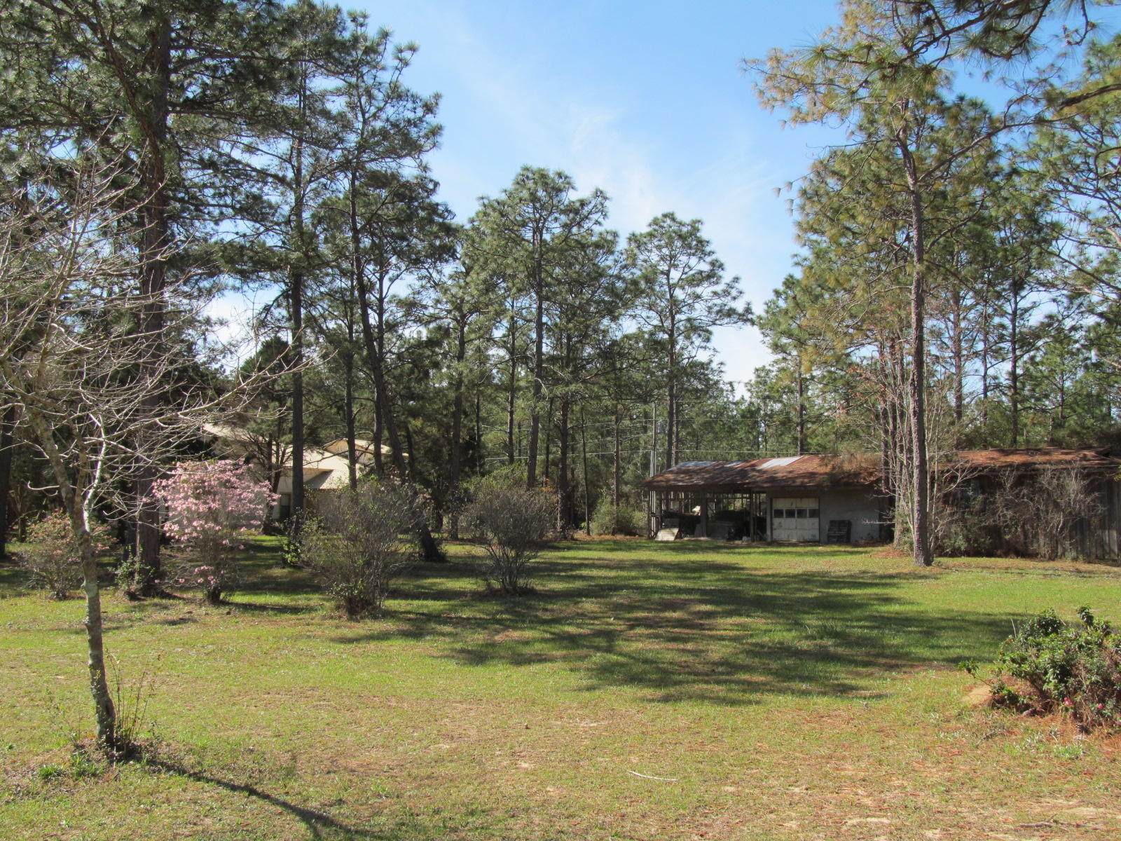 6 unit apartment building & a 1382 S.F. rental home. Great location. South of I-10. Easy access to the new Lecom Dental School. Each year a new crop of dental students comes to Defuniak Springs to finish their last year of residency. And every year these dental students struggle to find nice, clean, safe and affordable places to live while they train. With a little love and some minor upgrades this rental complex could be just what our visiting dental students are looking for. Shown by appointment 24 hours notice mandatory.