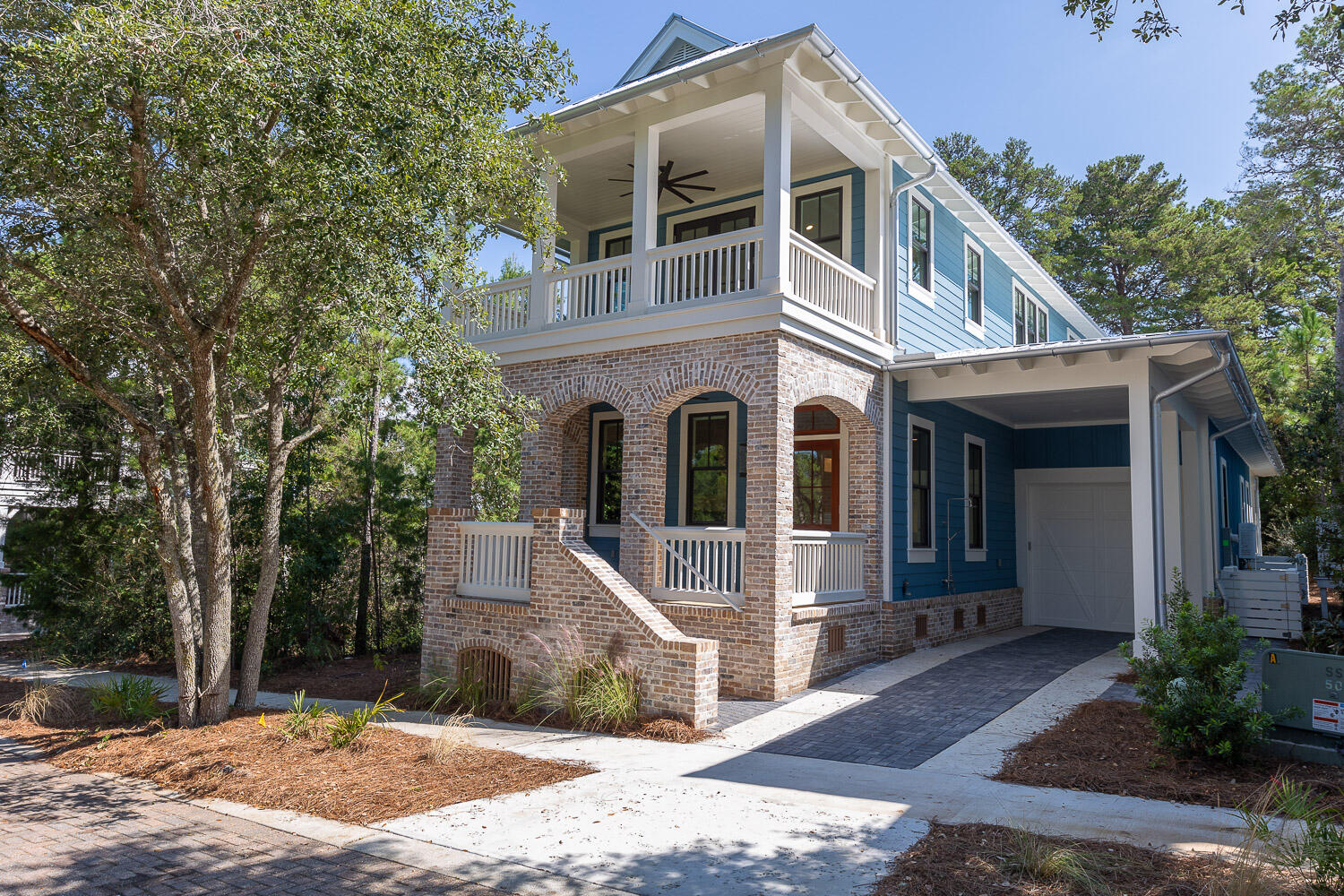 MOTIVATED SELLERS: Luke and Blue built custom designed home with enlarged lot in the rear for extended living, with a gas fire pit. Seashore wood flooring everywhere and high-end cabinets. Private baths for each bedroom with private office on the first floor. Master bedrooms on the first and second floor. Three large porches, one screened with grille. Floored attic for storage. Imported handmade bricks for an elegant look. Home in front of the community pool. TVs are installed throughout the home. Two EV outlets are installed in the garage and carport. Cambria kitchen counters and backsplash. Built in motorized window coverings on the main level, installed W/D in the spacious laundry room. Nearby guest parking, convenient pool side location. Dog friendly back yard. This home is not rental restricted and would make an excellent long term or short-term rental or an excellent Primary home. The majority of the homes in Forest Lake are not rentals, though it is permitted. The extended Wi-Fi and TV's are already installed and connected to Mediacom so these are ready to be transferred. The small office located on the first floor is perfect for a private home working space or for a rental this could be a 5th bedroom bunk room. The back porch has a grille and is screened, with the fire pit located in the back yard. The backyard is larger than usual due to the lots extended shape, making it a nice pet friendly space for your dogs. The location is excellent for the subdivision extended lawn play area with the lake, playground and pool so close. The kitchen cabinets are lighted and the interior hardware designs that are above average and highly desired with Cambria counter tops and back splash. The kitchen island has an ice-make, wine/beverage cooler and a drawer microwave. Home has Gas stove with a 22 sq.ft Refrigerator. There is a large pantry area immediately next to the kitchen for extra storage. The attic is floored with standing height storage of several hundred sq.ft. and is fully insulated so that it remains temperature friendly year around. There is a semi-master bedroom on the first floor and a full master bedroom on the second floor. These second and third bedrooms are wide enough for two king sized beds or a bed and sitting area. There are motorized window coverings on most of the lower floor windows.
The landscaping is as maintenance free as you can get, with no grass and low maintenance shrubs.
There is a Sonos sound system in the home that is controlled by a phone ap. There is a separate control for the kitchen, master bedroom and back porch. This allows the owner to access many different songs from a large cloud assortment of songs.