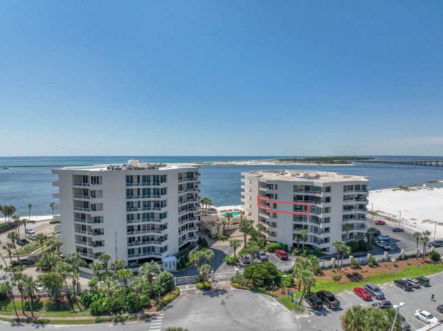 Unit 403 East Pass Towers offers breathtaking sunrise views of the Harbor and sunset views of East Pass/Gulf. Located at the end of Holiday Isle and surrounded by beaches, the unit offers appox.1500 sq ft and a 30'X15' Living room with Wireless Internet and built in work station. Assigned parking space 403 and storage unit convey. Relax on approx. 465 sq ft of balconies.  Access one large balcony from the Living Room, Dining Area and Guest Bedroom, and another private balcony from Master Bedroom. Both bedrooms have King Beds and Master has ensuite bath. Kitchen is centrally located and features stainless appliances and granite counters. A breakfast bar adds seating to the eat-in kitchen/dining area